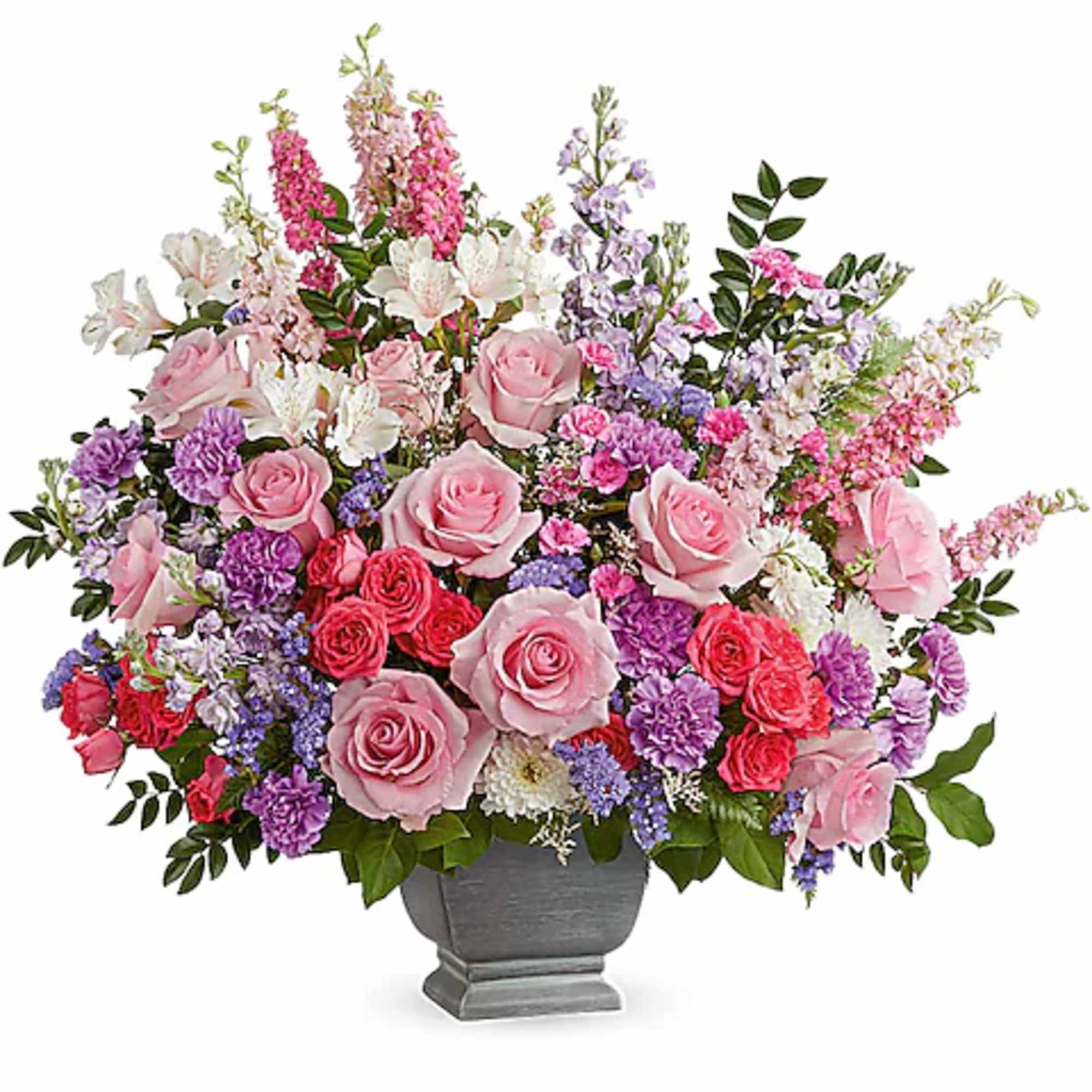 Pink and purple mixed flower arrangement in a gray urn vase
