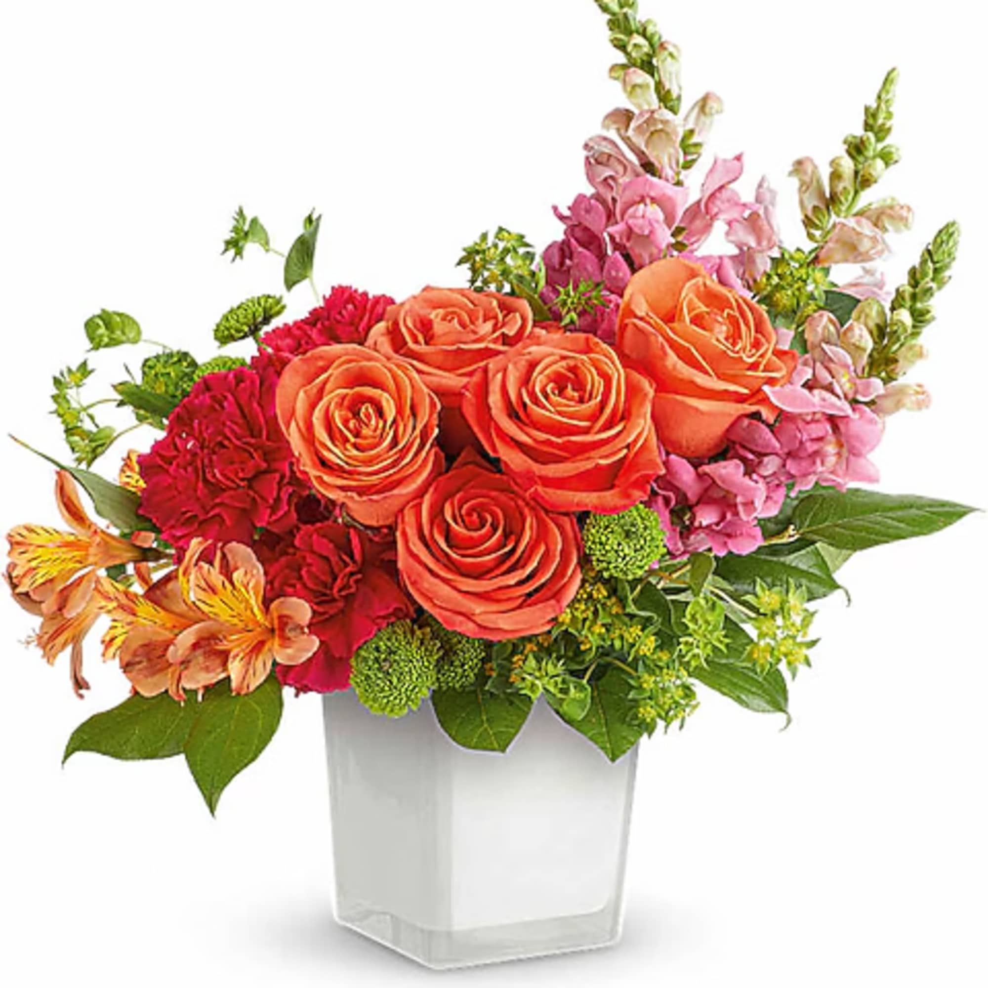 Orange roses and pink mixed flowers arranged in a clear square vase