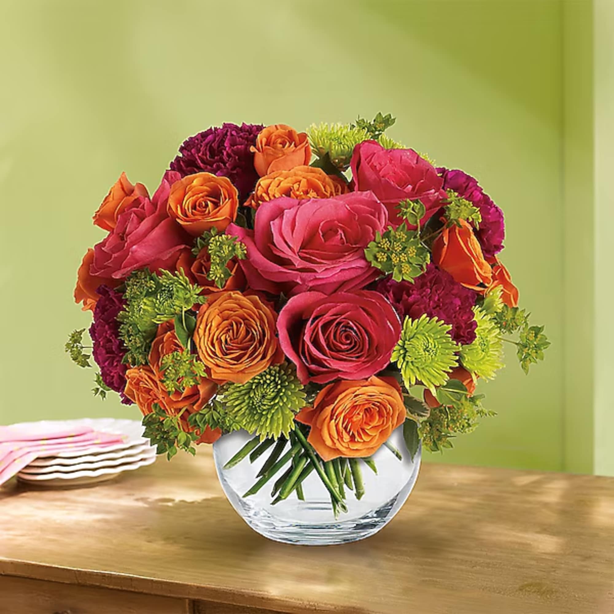 Bouquet of pink, orange, and purple roses in a clear glass vase, photo 2 of 2