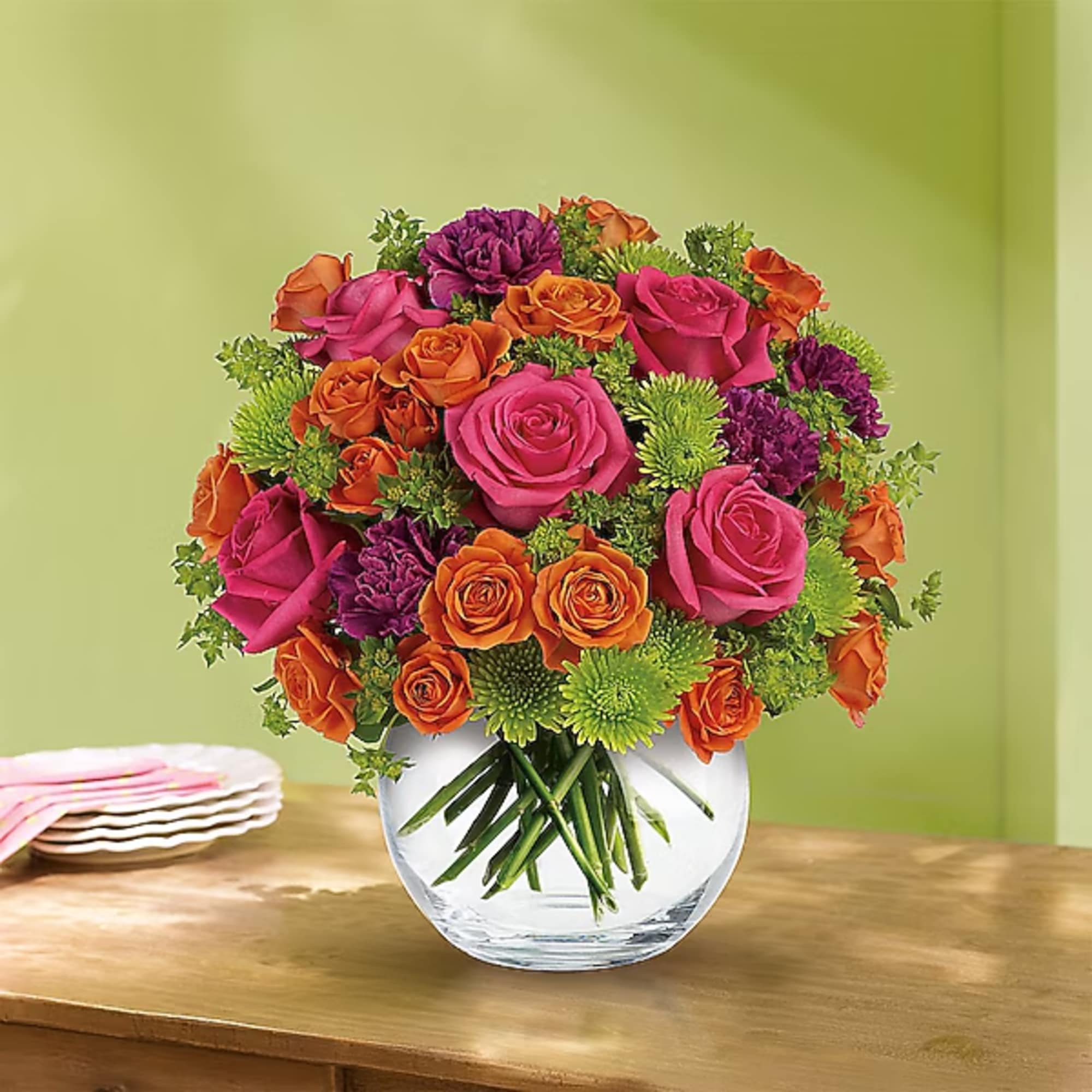 Bouquet of pink, orange, and purple roses in a clear glass vase, photo 2 of 2