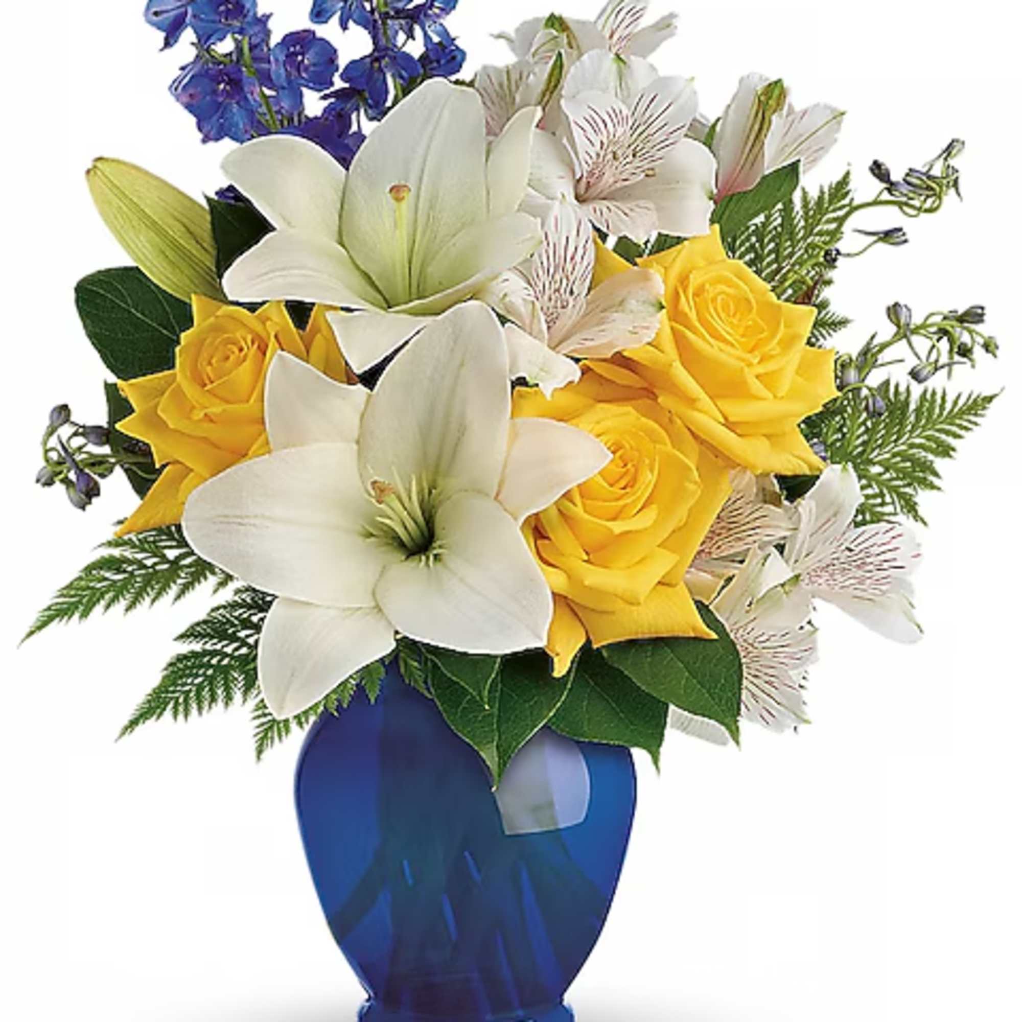 Bouquet of white lilies, yellow roses, and blue flowers in a blue vase