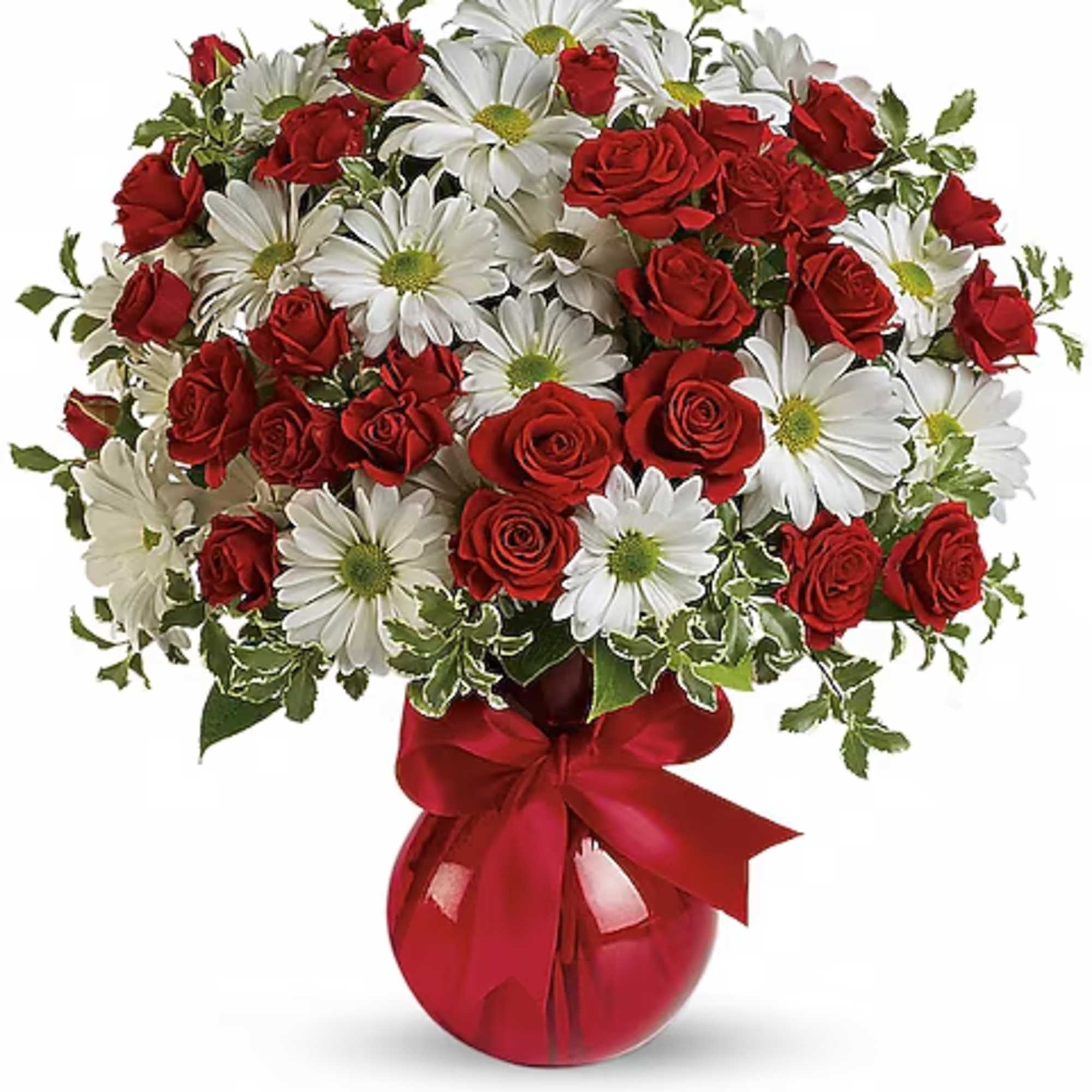 Bouquet of red roses and white daisies in a red vase with a ribbon