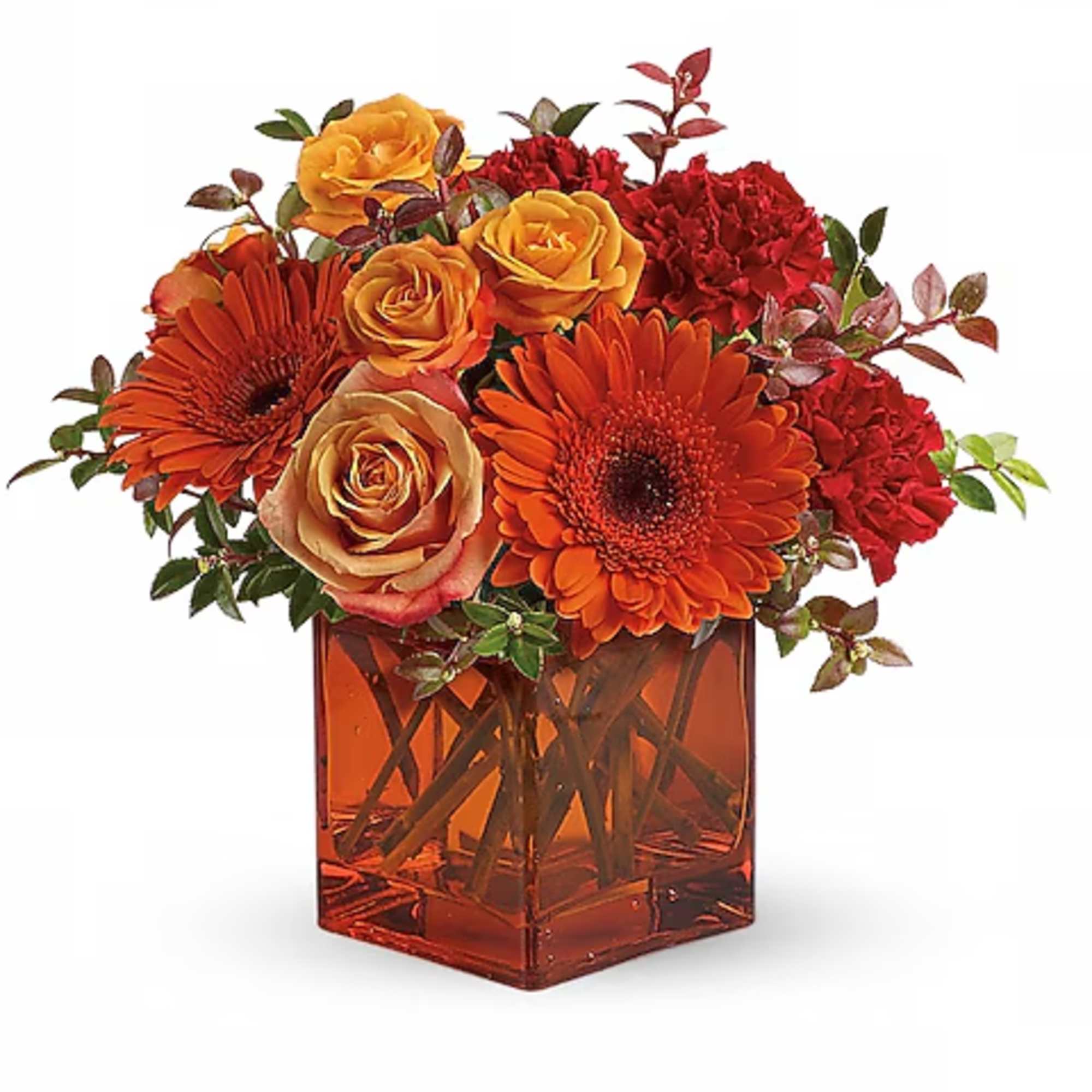 Orange and red flowers arranged in a square amber vase