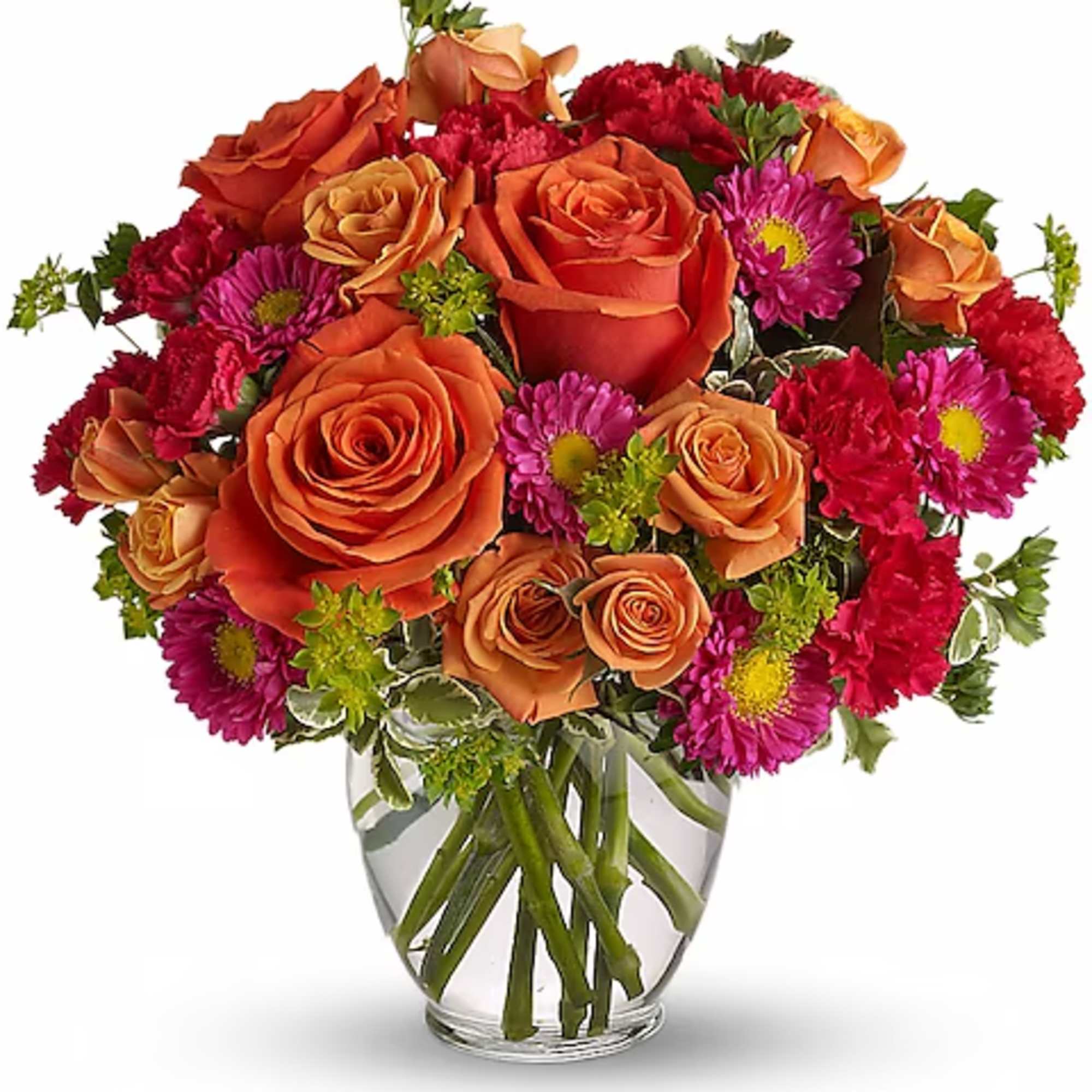 Orange roses and magenta daisies in a clear glass vase