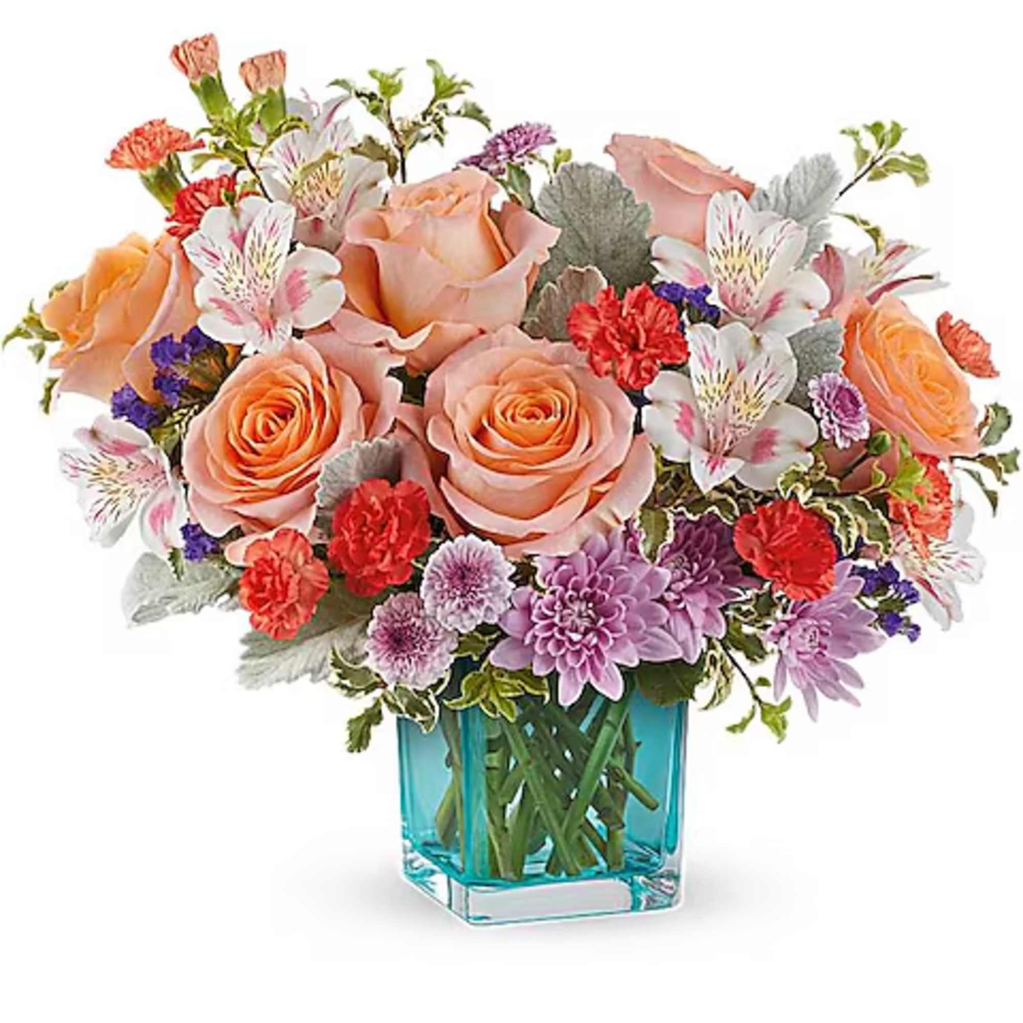 Mixed bouquet of peach roses, purple blooms, and white flowers in a blue glass vase