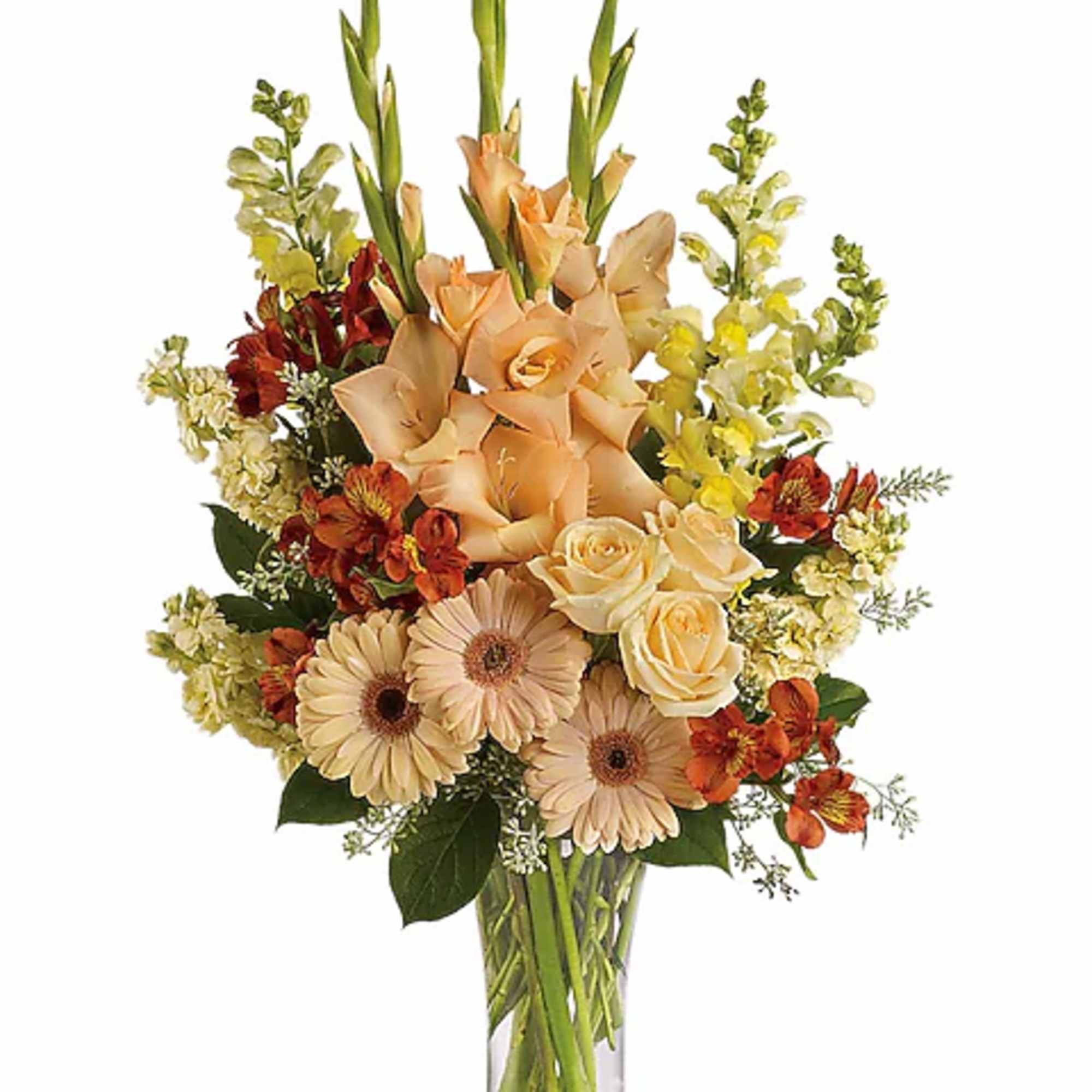 Peach and cream mixed bouquet in a clear glass vase