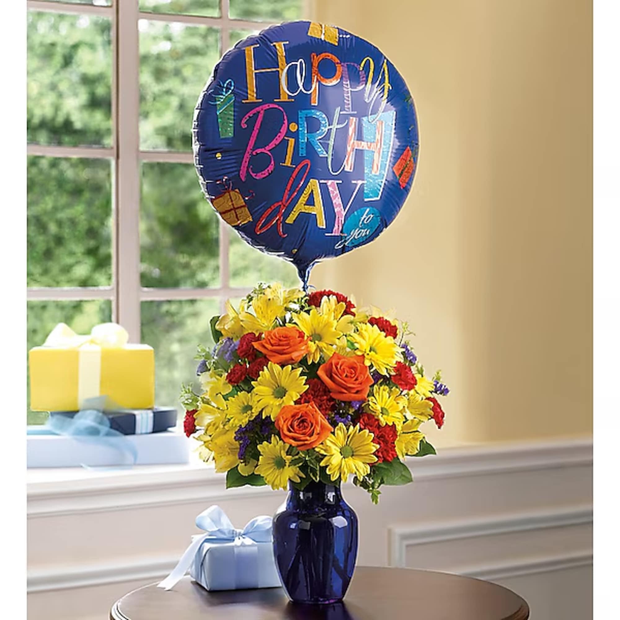 Birthday balloon above a colorful flower arrangement in a blue vase, photo 2 of 2