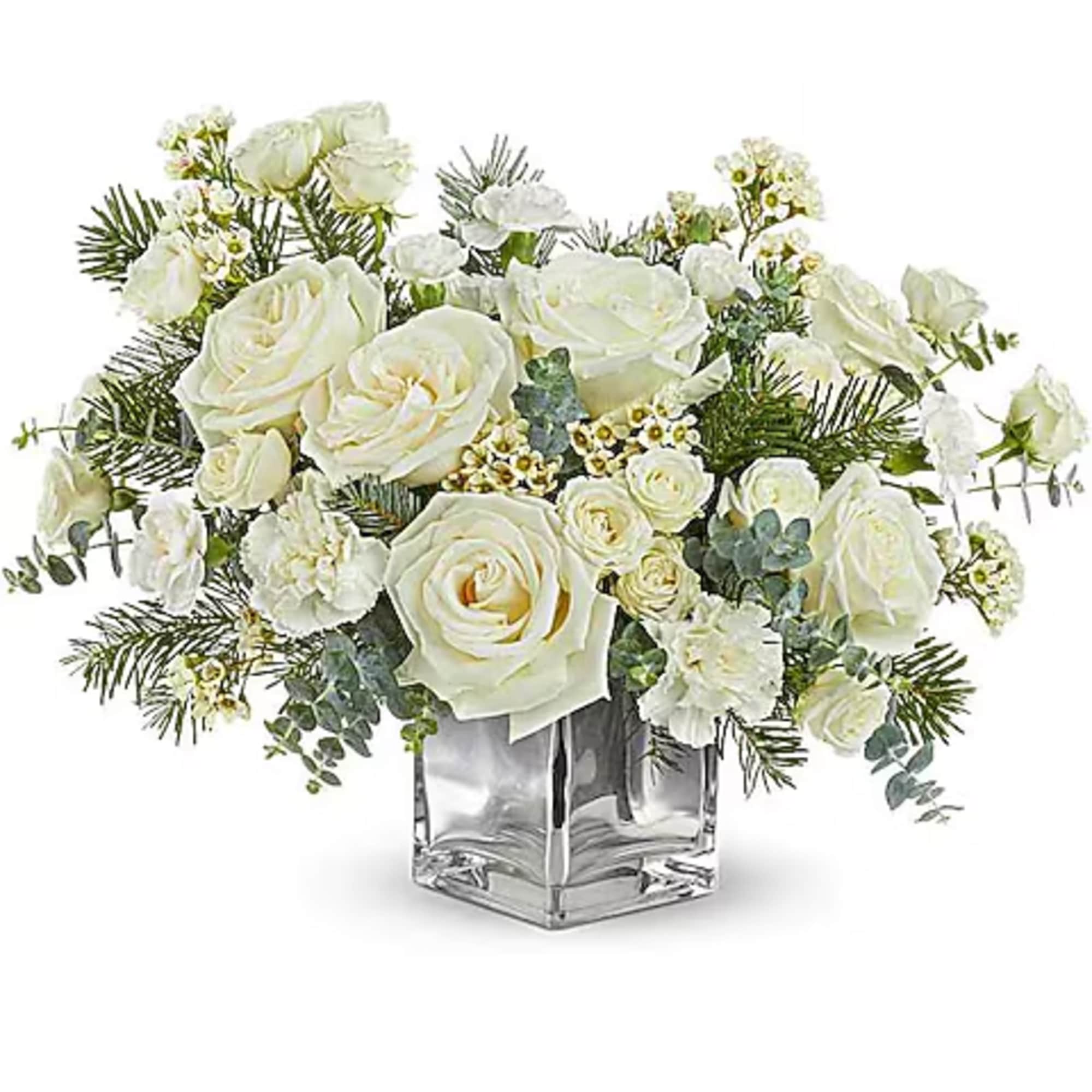 White roses and carnations in a clear square vase
