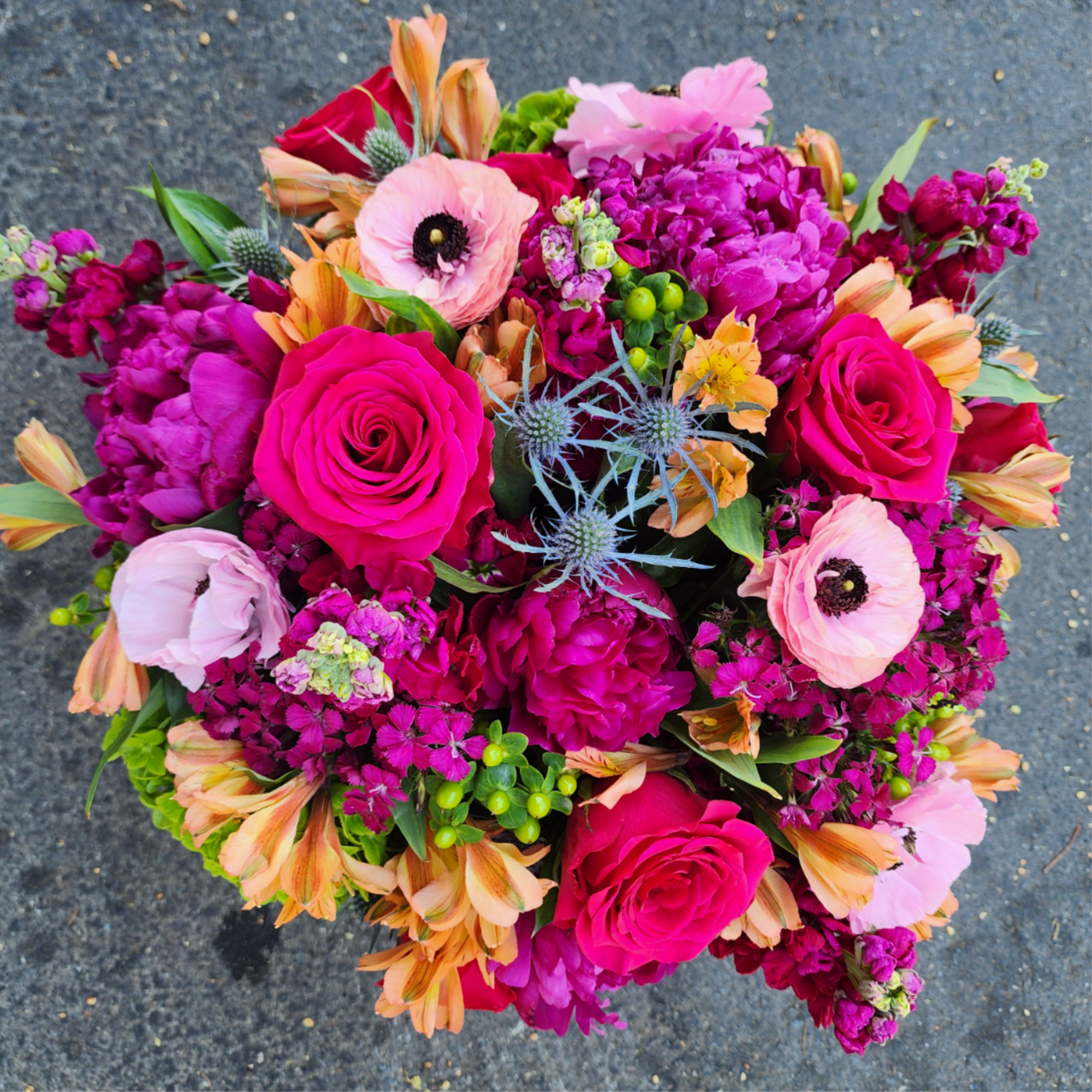 Bright mixed bouquet with hot pink roses and pale pink poppies
