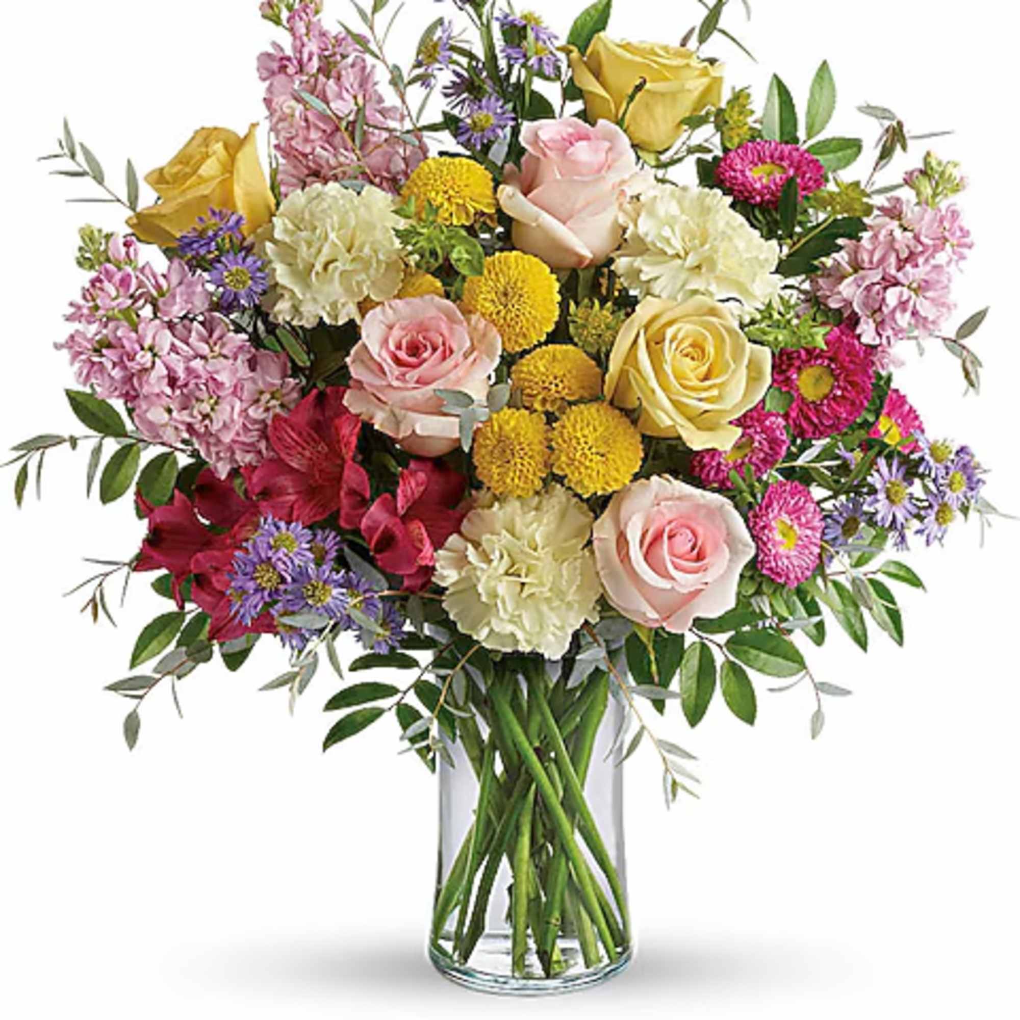 Mixed bouquet of roses, carnations, and daisies in a clear glass vase