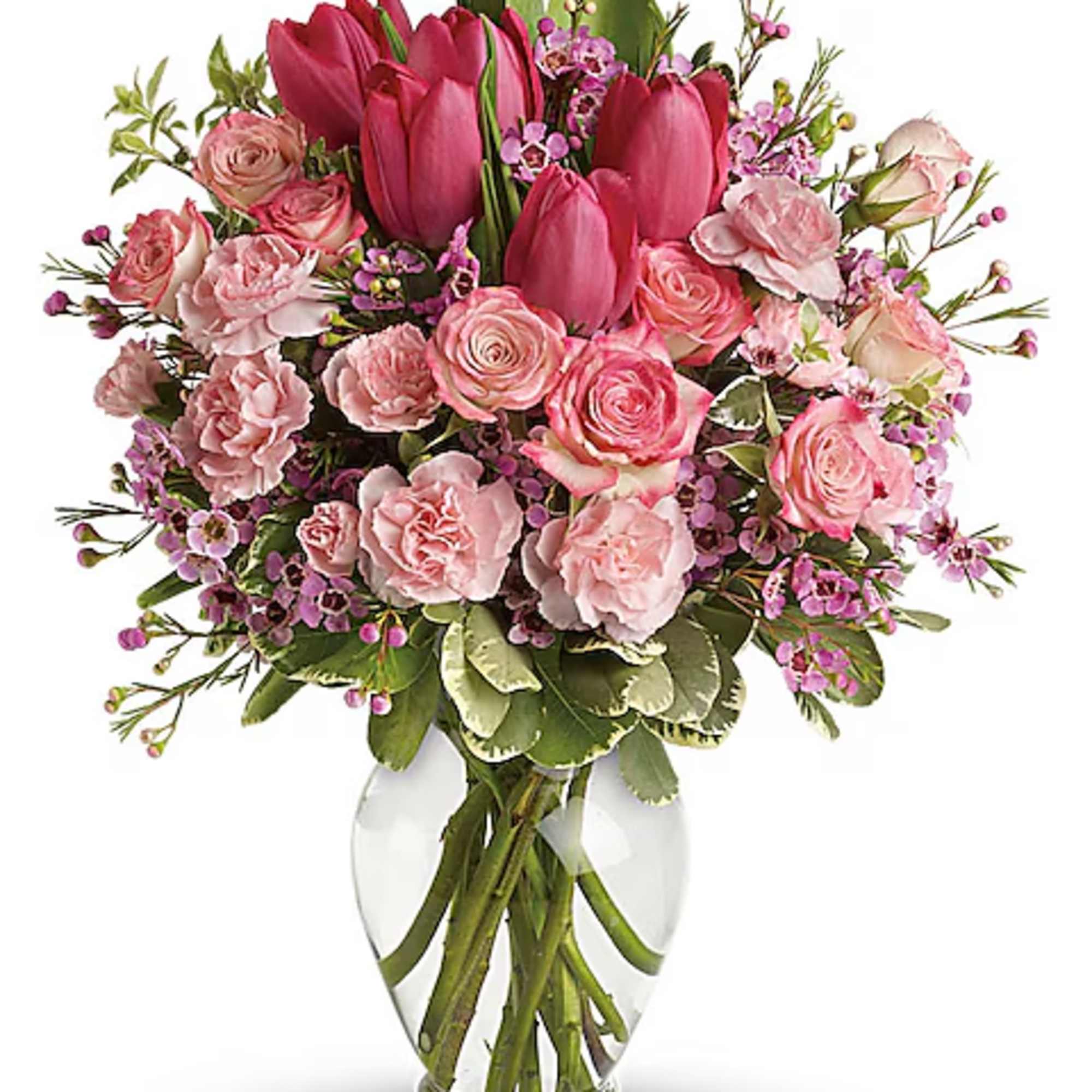 Pink tulips and roses arranged in a clear glass vase, photo 2 of 2