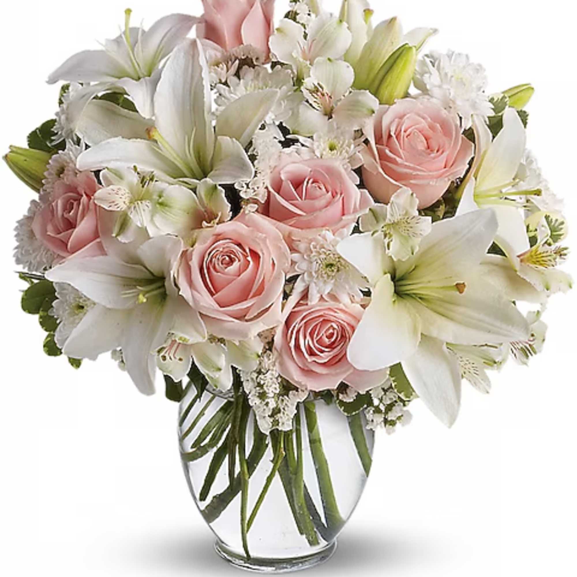 Pink roses and white lilies arranged in a clear glass vase, photo 2 of 2