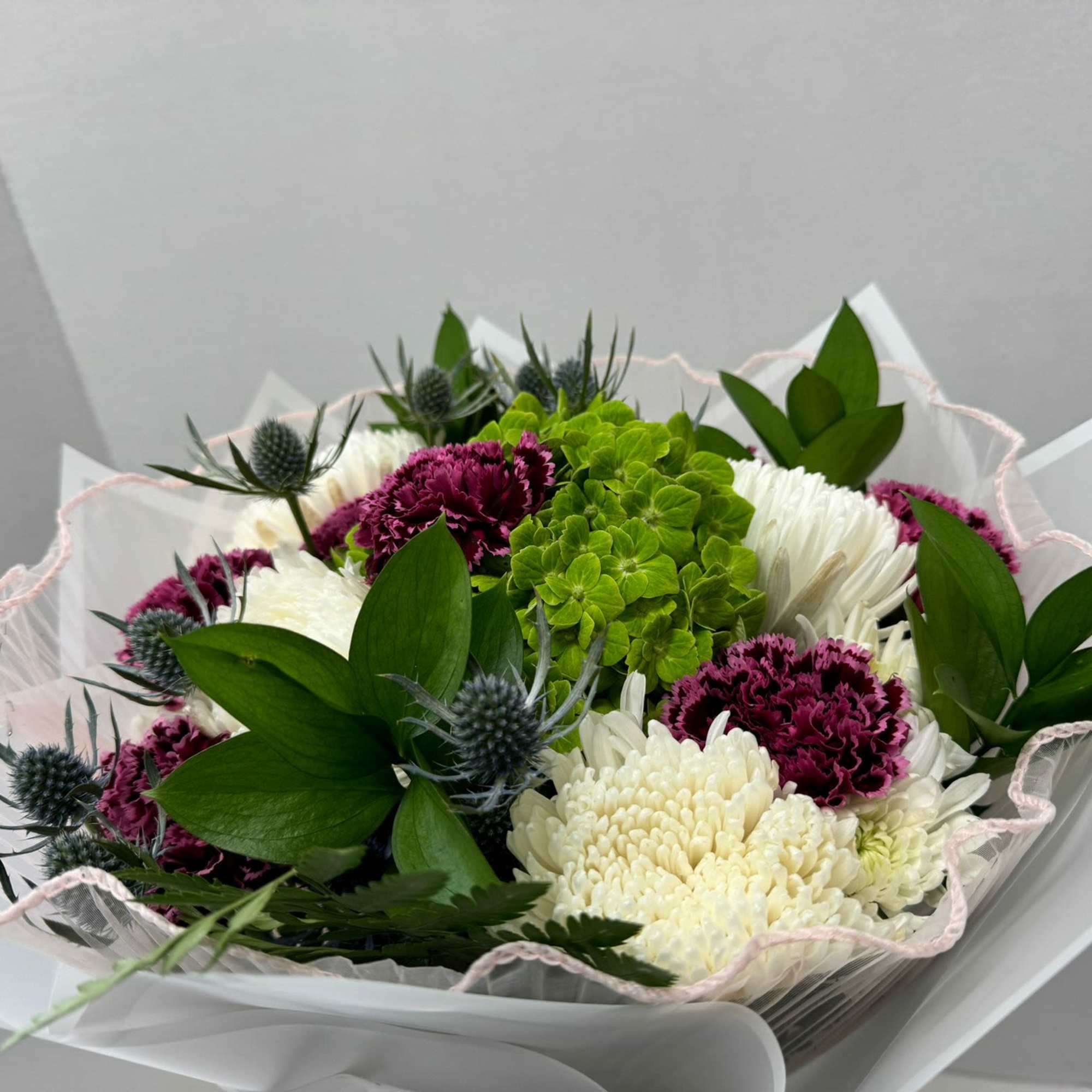 If you are looking for something different, this bouquet with chrysanthemums, carnations