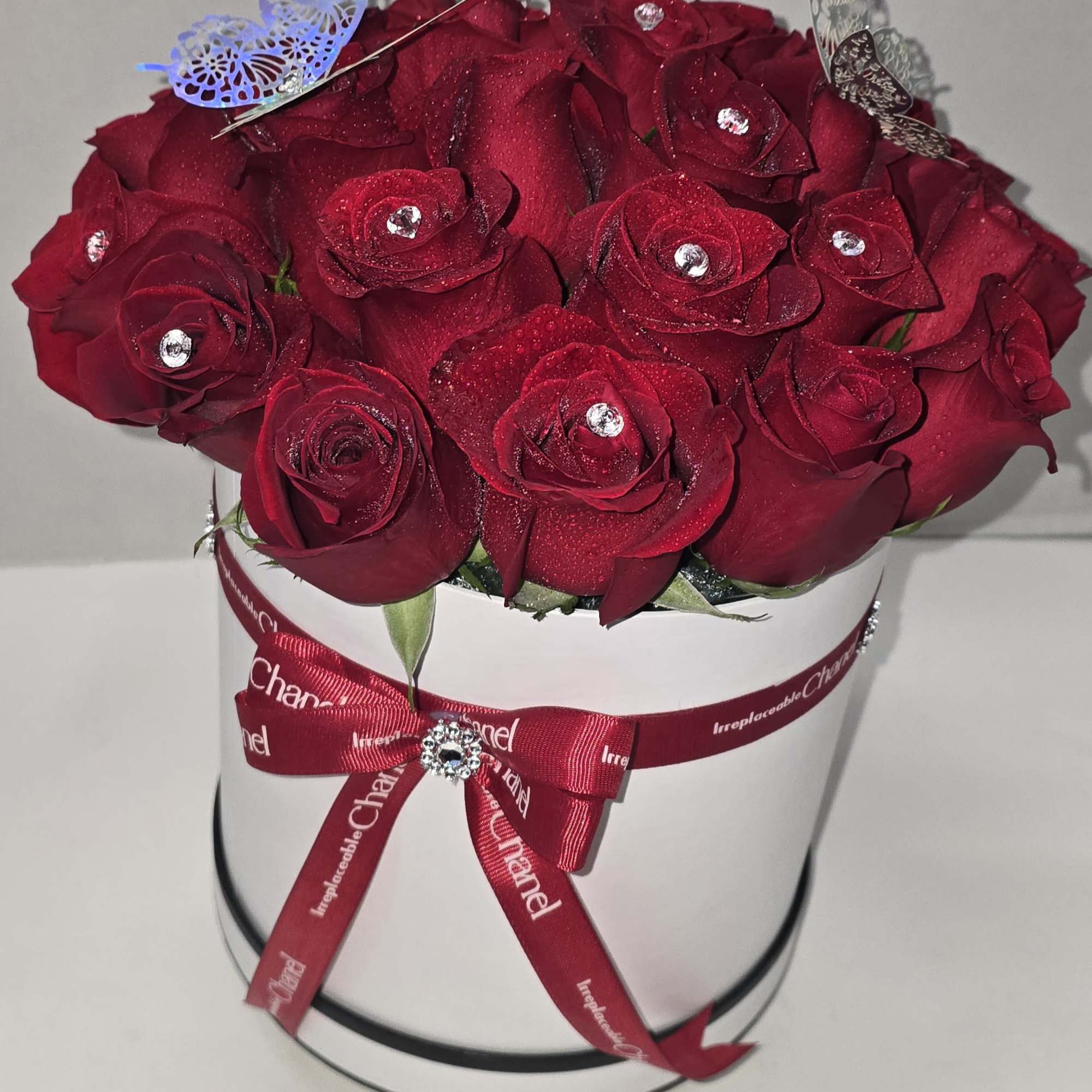 Our Cylinder of 24 Roses can be personalized in your preferred color, photo 2 of 3