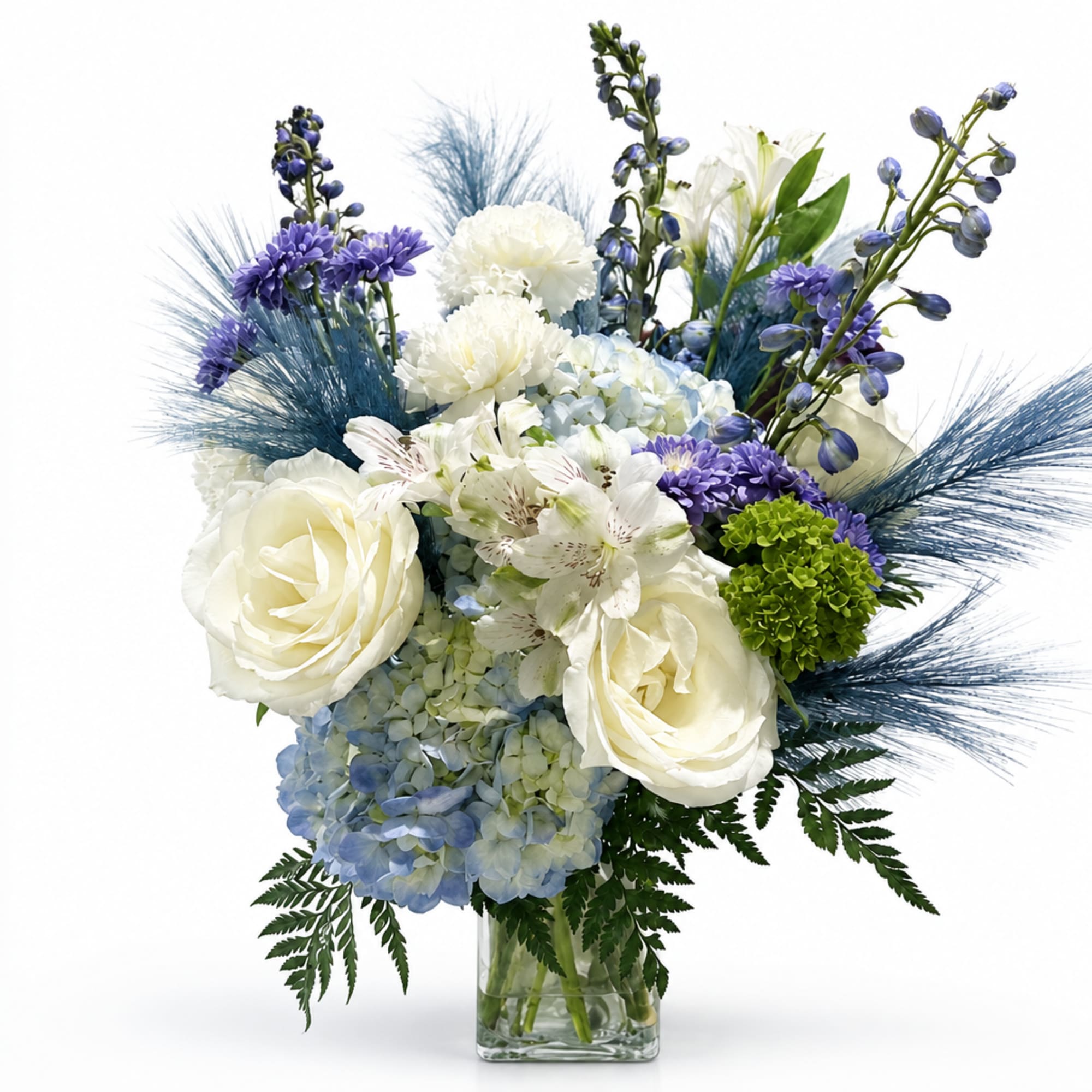 Blue and white floral arrangement in a clear glass vase