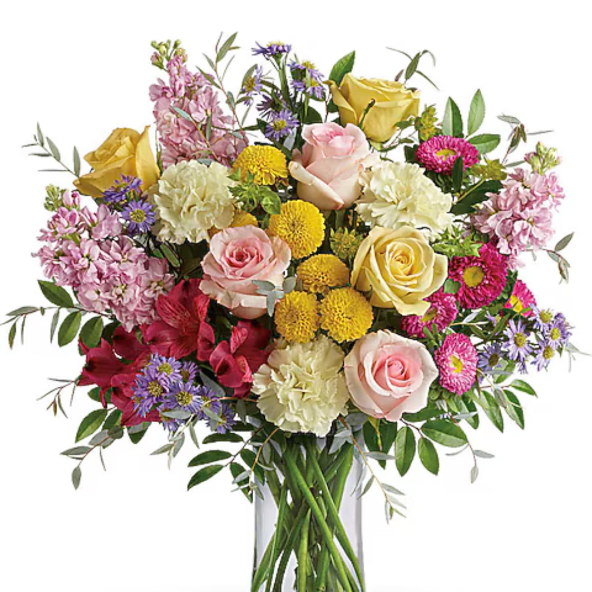 Mixed bouquet of roses, carnations, and daisies in a clear glass vase