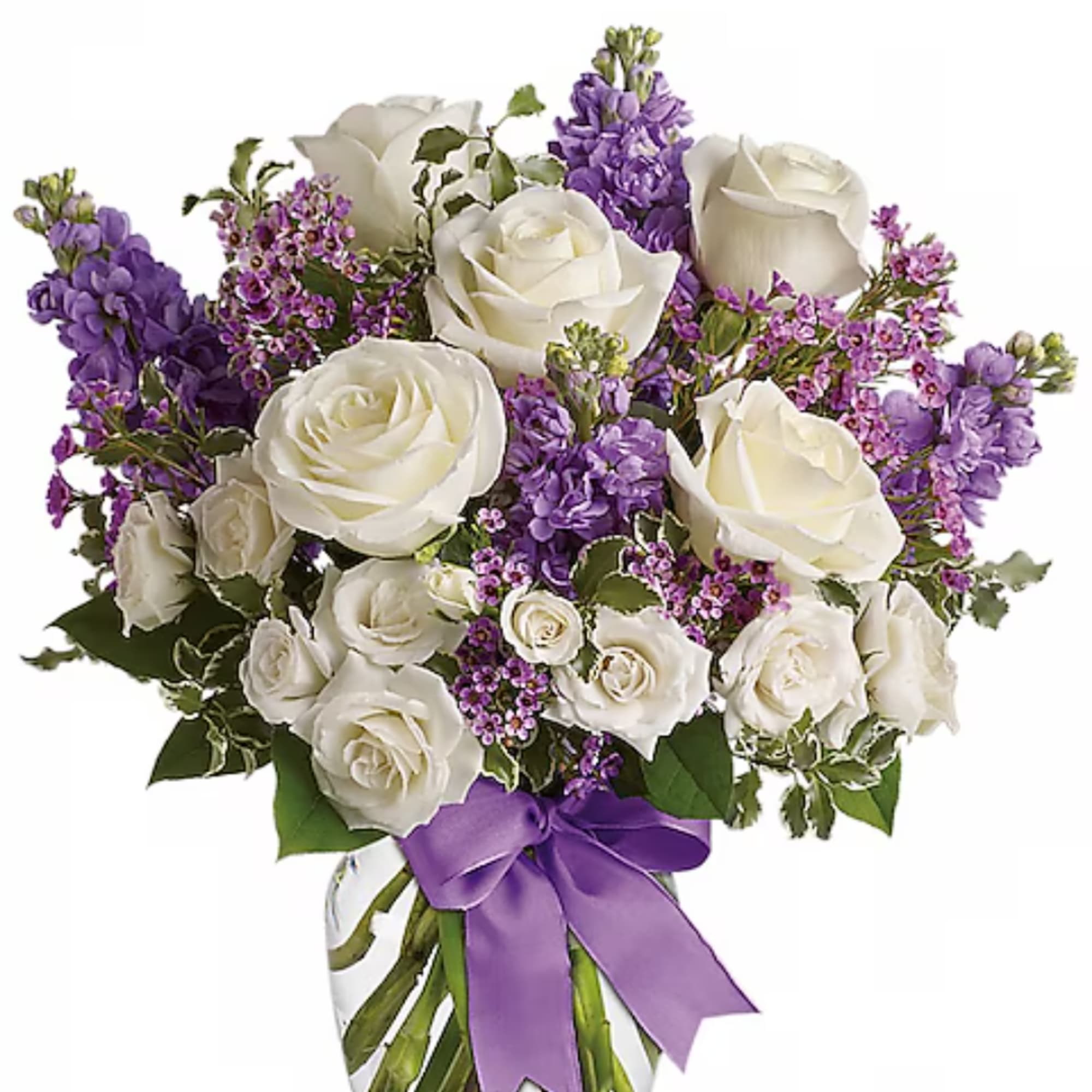 White roses and purple flowers arranged in a bouquet with a purple ribbon