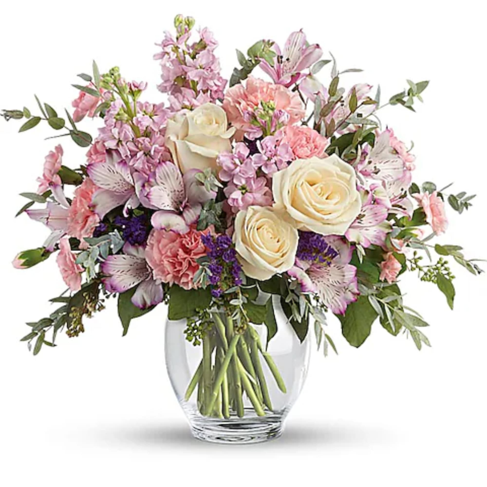 Pink and cream mixed bouquet in a clear glass vase