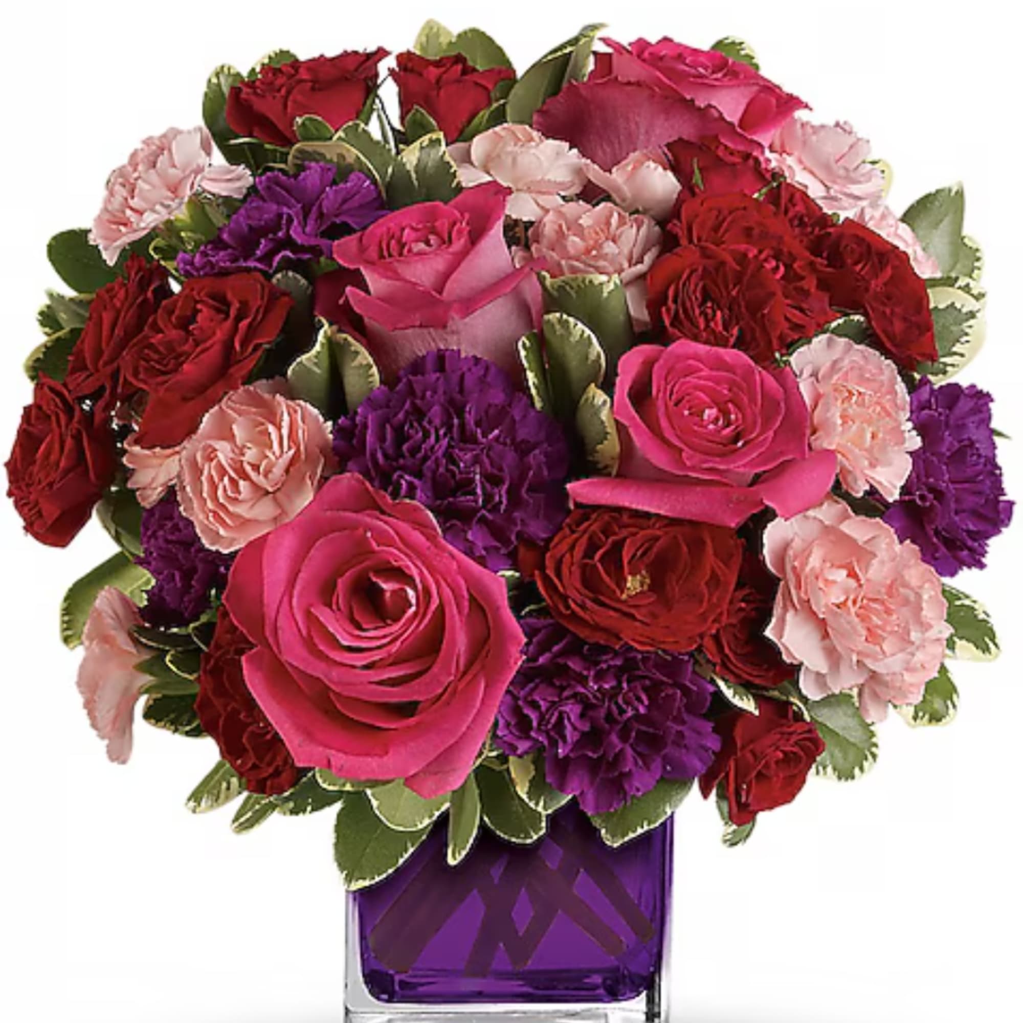 Bouquet of pink, red, and purple flowers in a purple vase