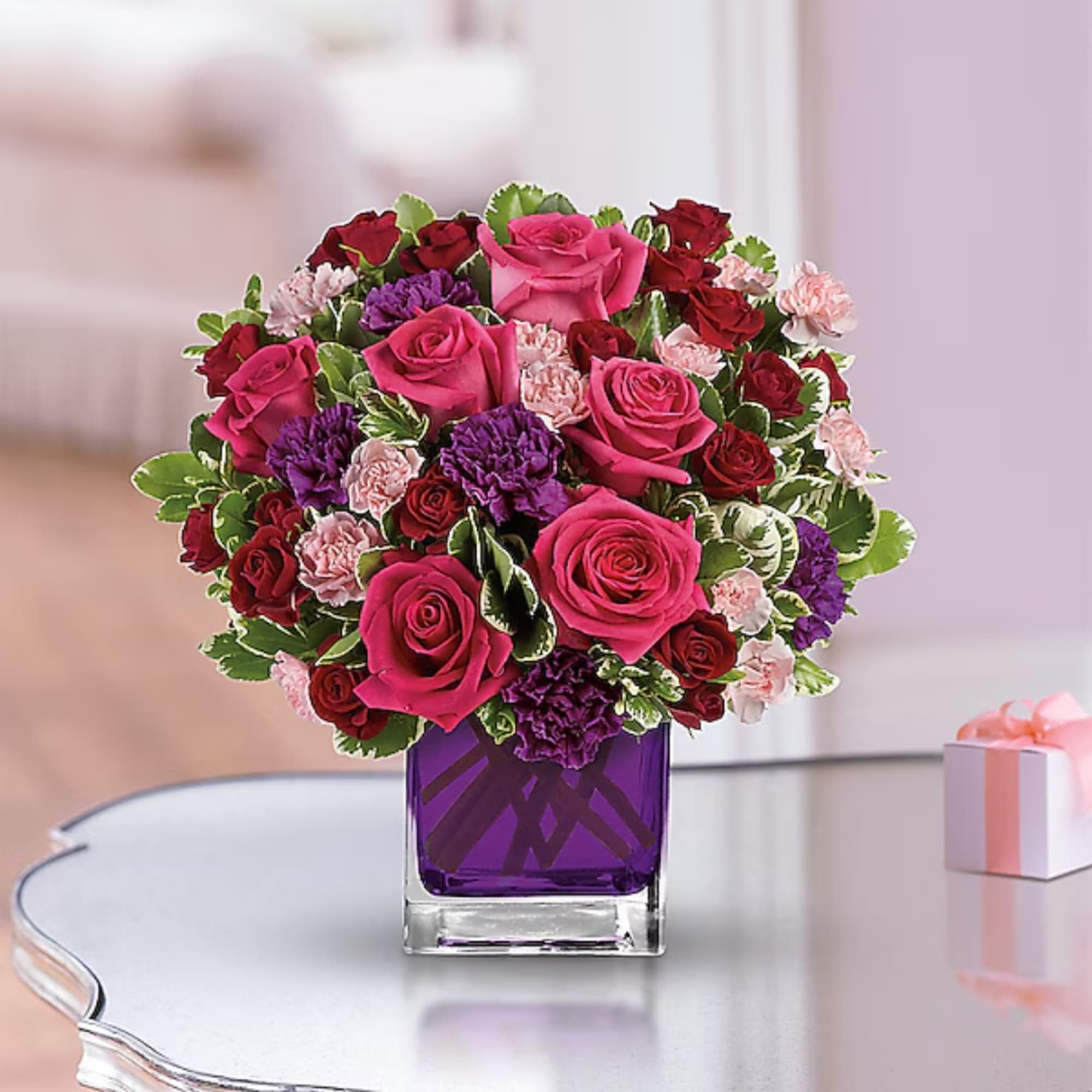 Pink and red rose bouquet in a purple glass vase, photo 2 of 2