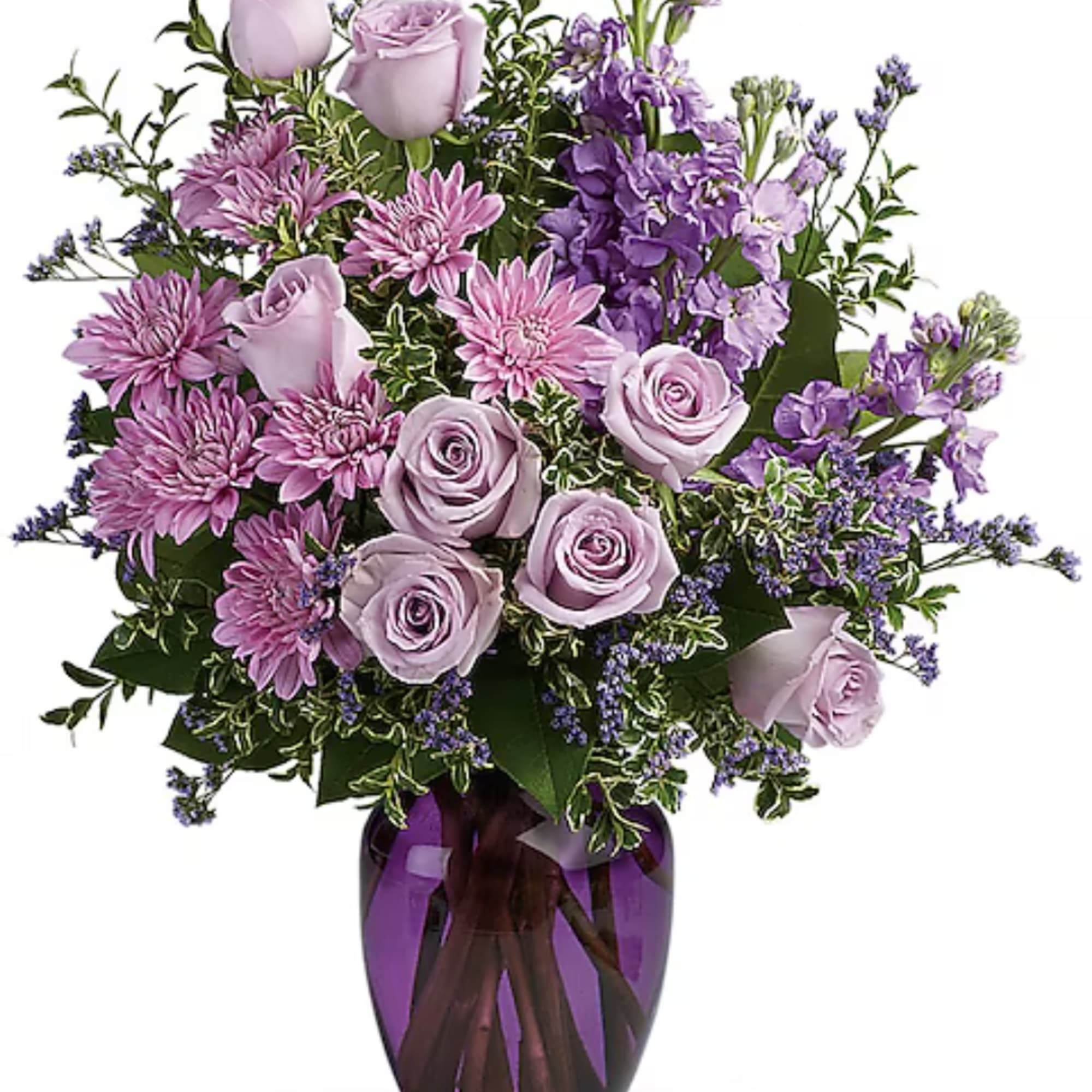 Lavender roses and purple flowers arranged in a purple vase