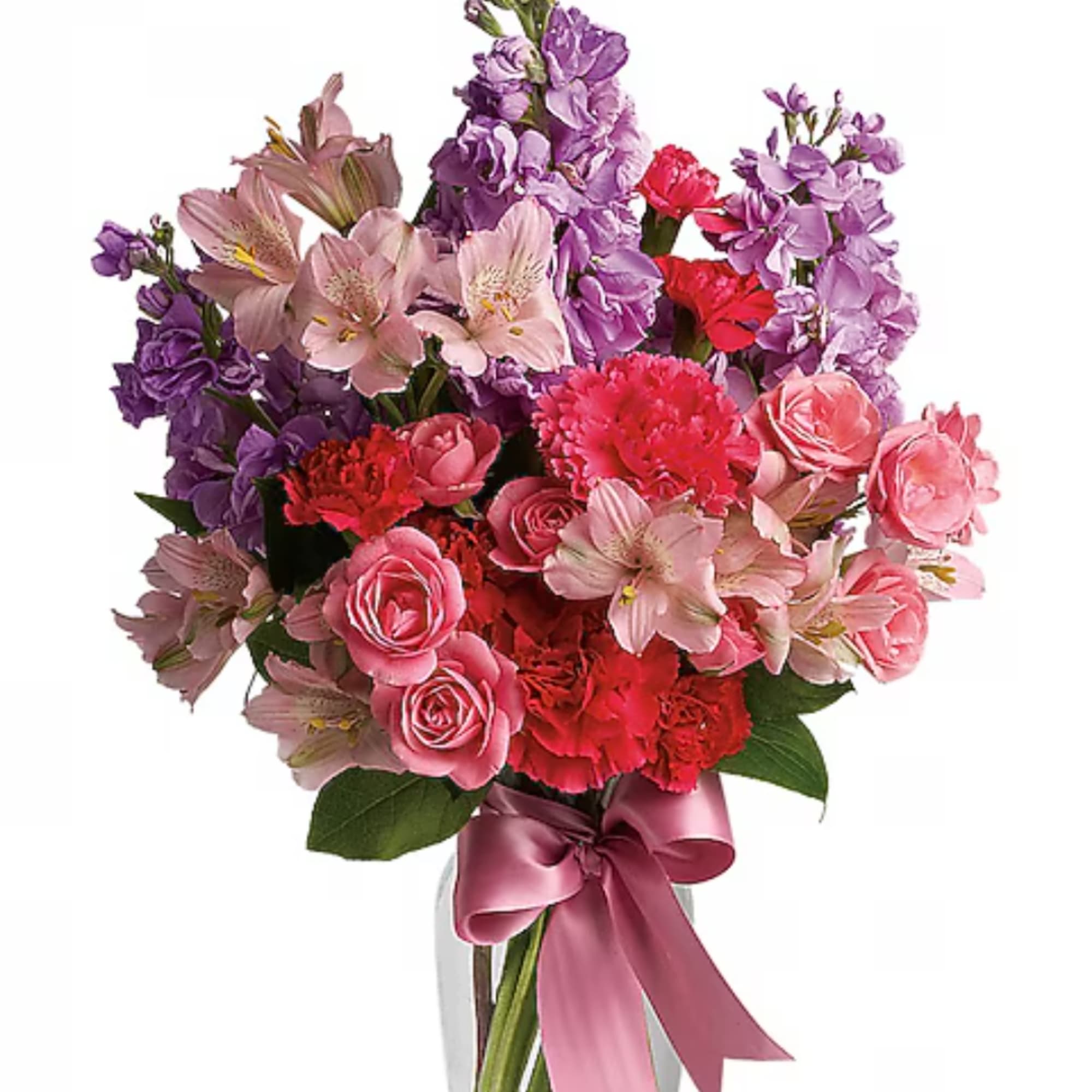 Pink and purple mixed flower bouquet in a clear vase with a satin ribbon