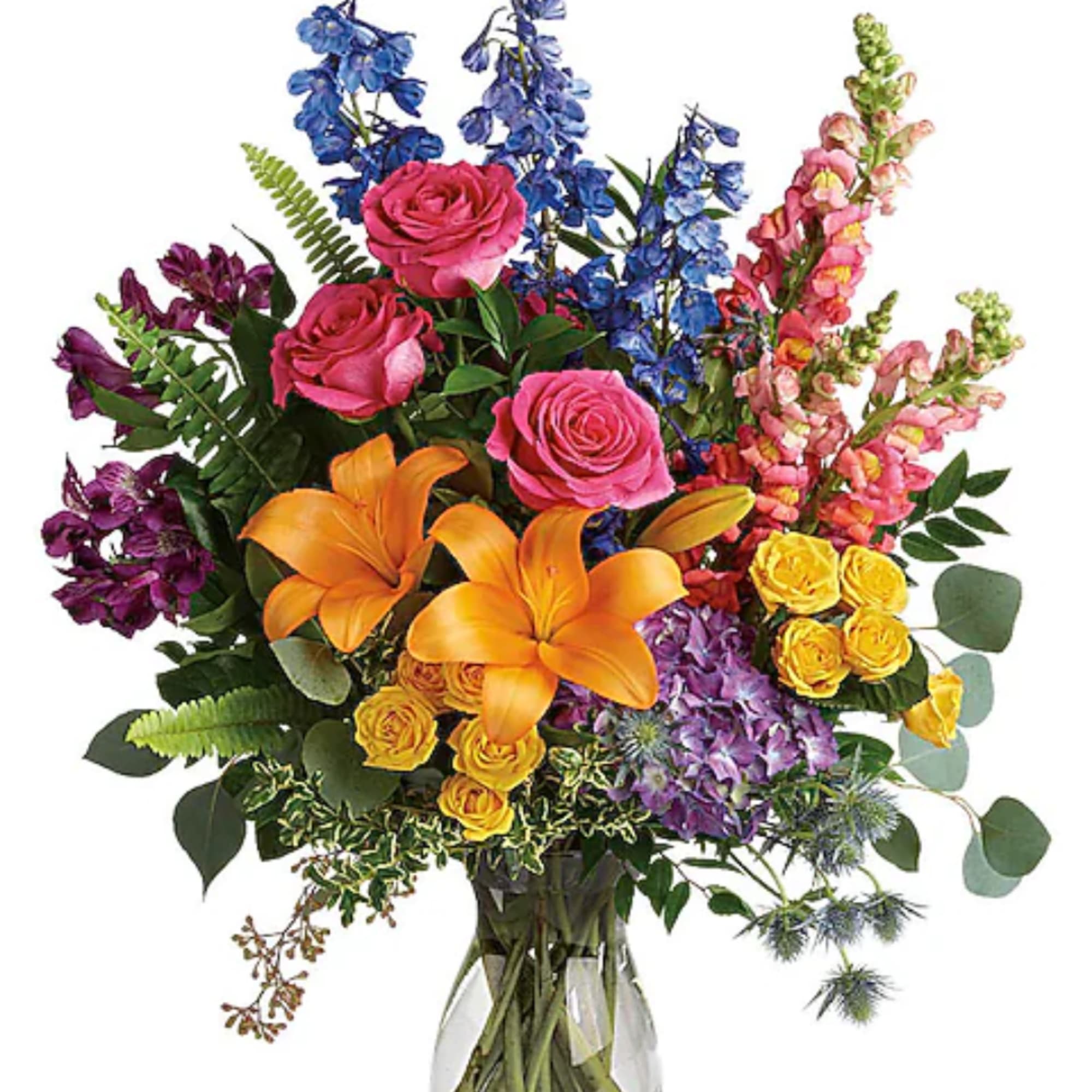 Colorful bouquet with roses, lilies, and snapdragons in a glass vase