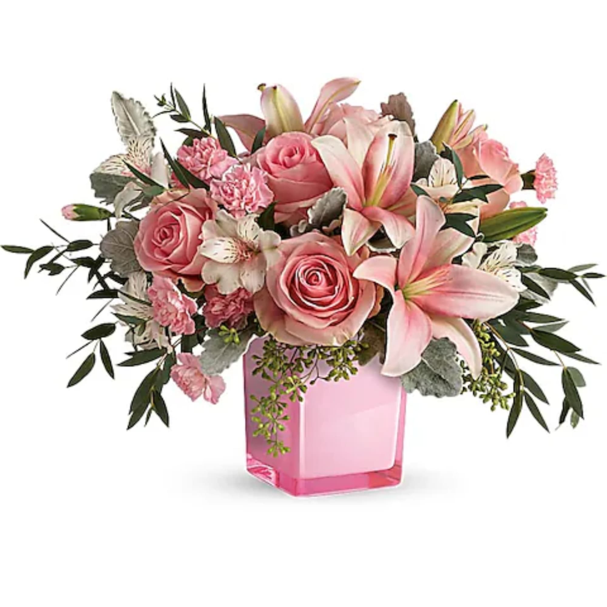 Pink roses and lilies arranged in a pink glass vase