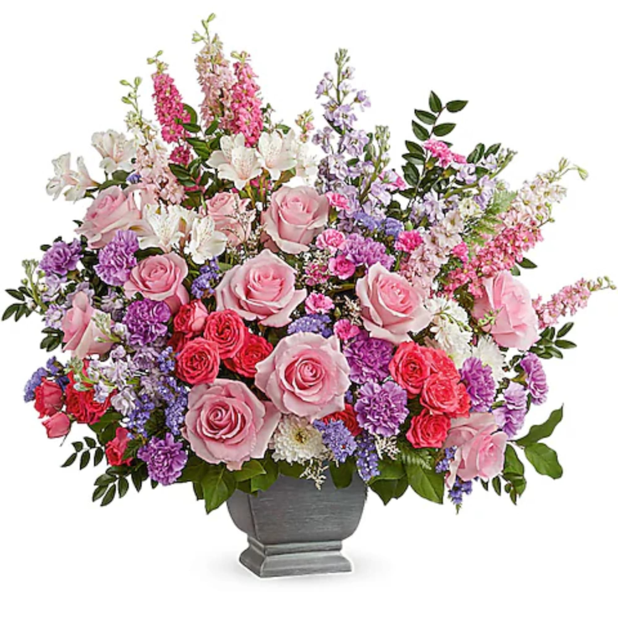 Pink and purple mixed flower arrangement in a gray vase