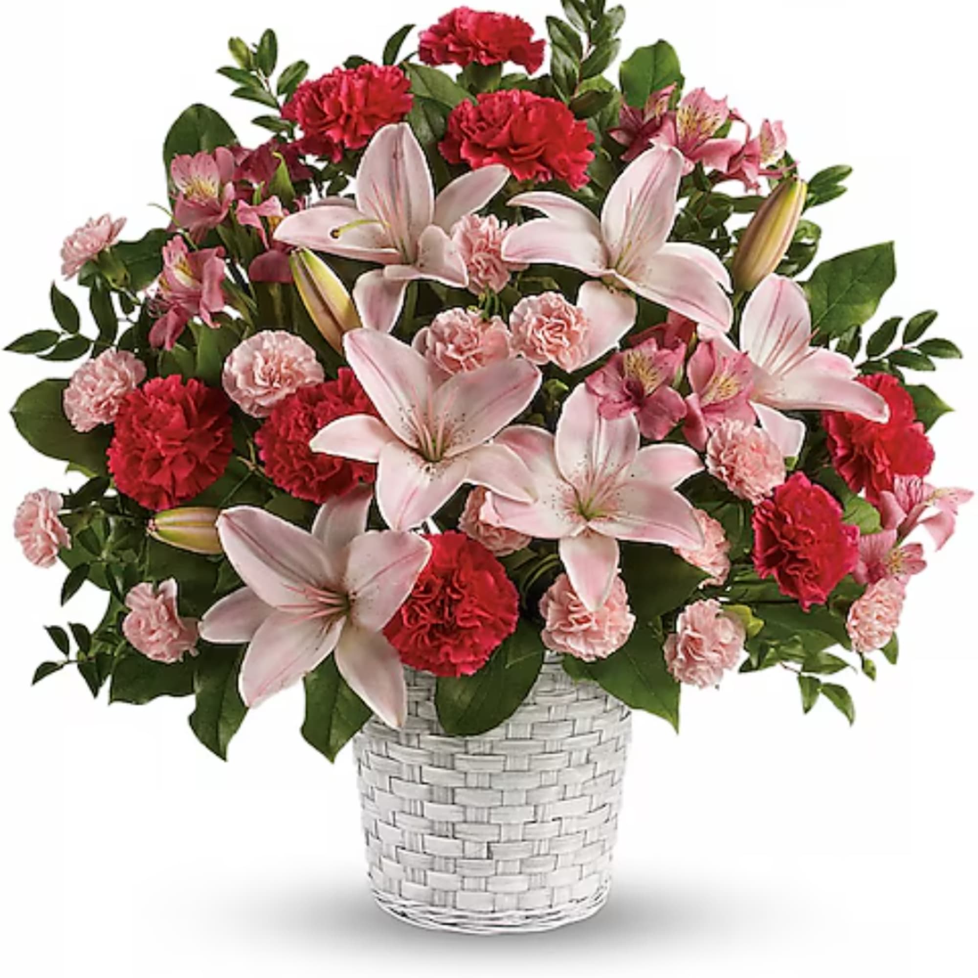 Pink lilies and red carnations arranged in a white woven basket