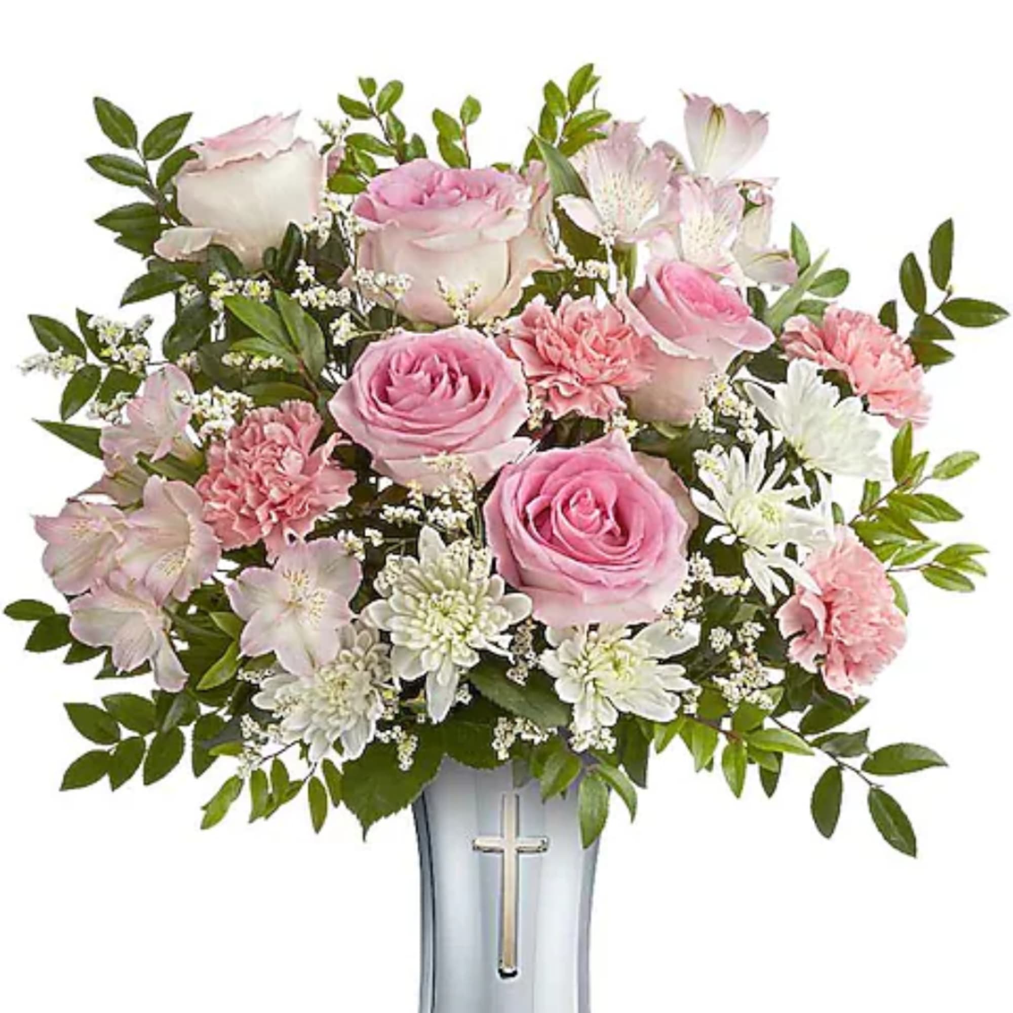 Pink and white flowers arranged in a silver vase with a cross emblem