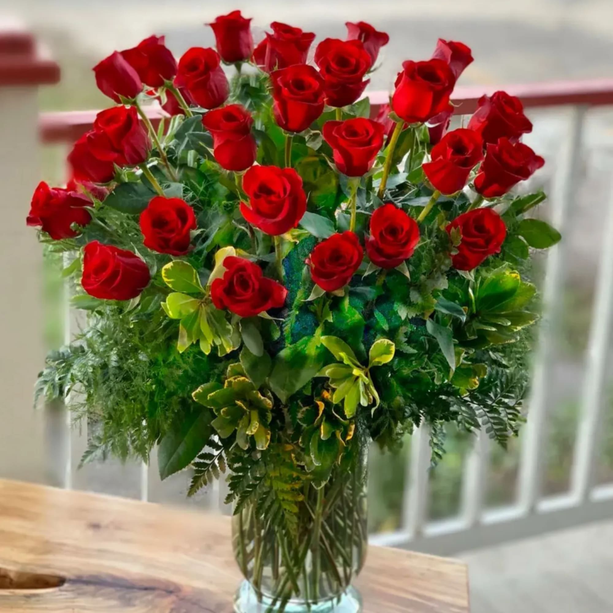 Bouquet of red roses in a clear glass vase