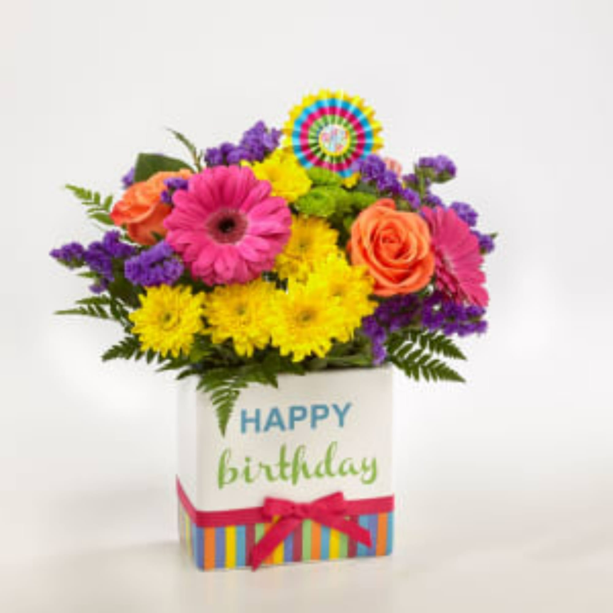 Bright mixed bouquet in a birthday gift box with a ribbon