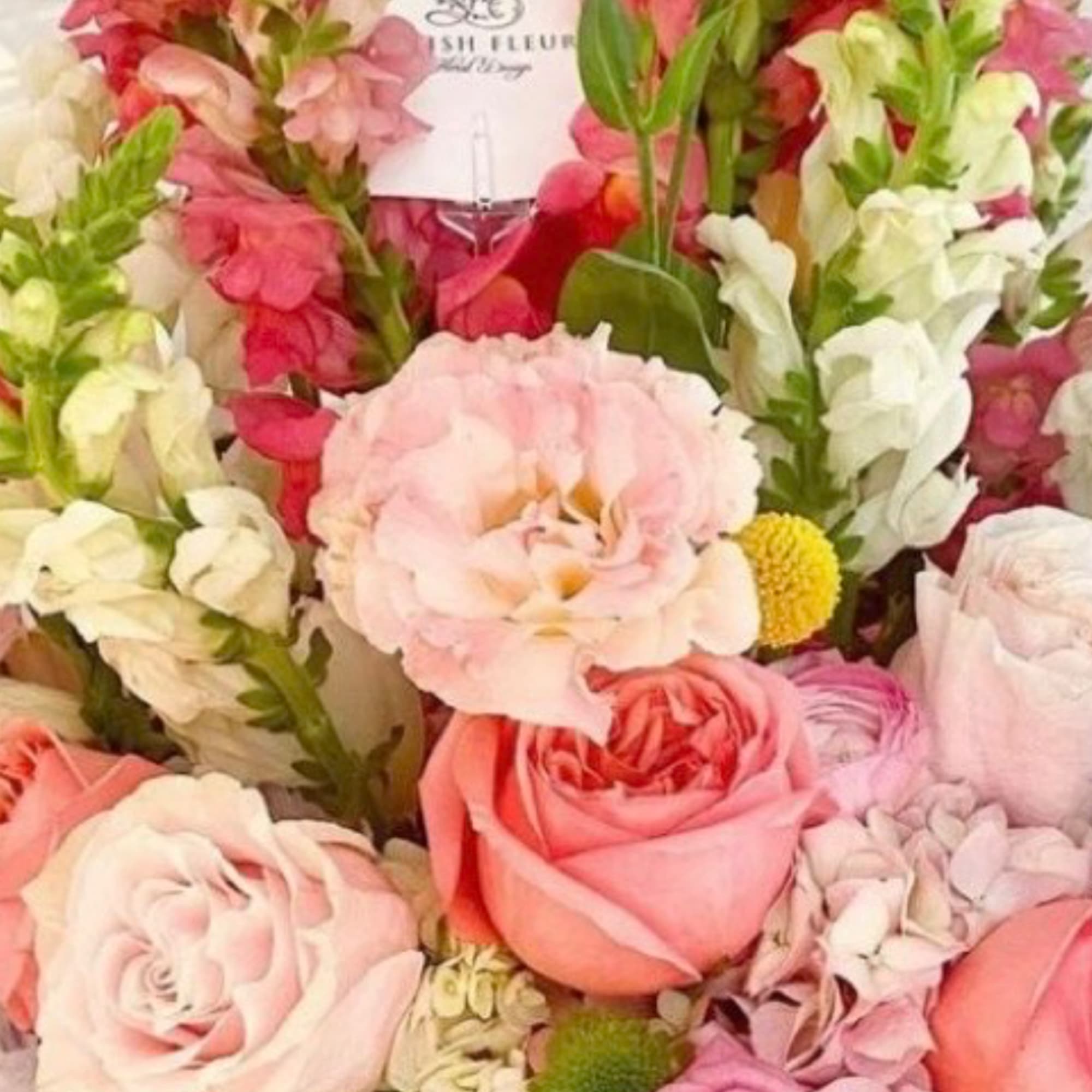 Pink and white bouquet with roses and snapdragons