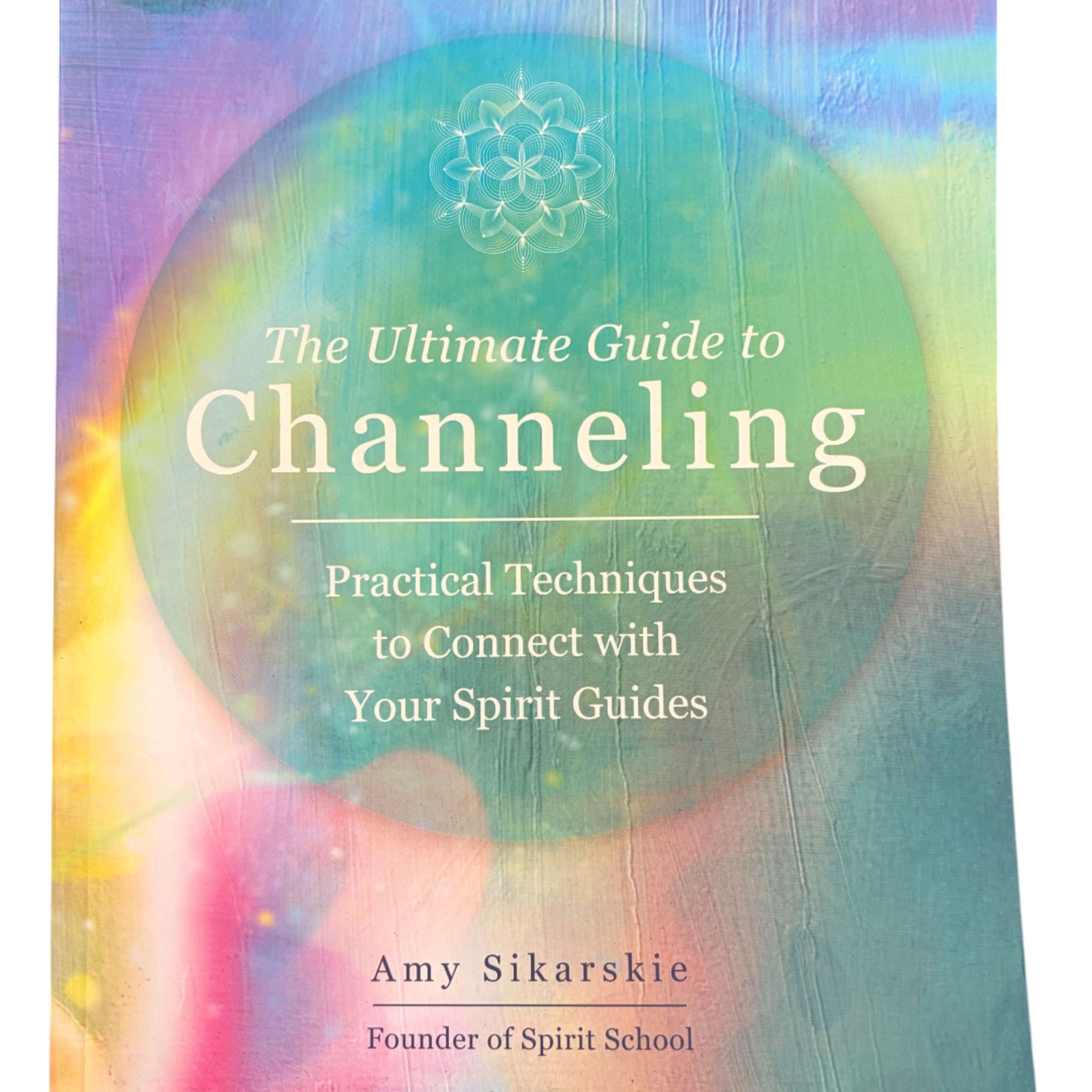 Colorful book cover with the title "The Ultimate Guide to Channeling"