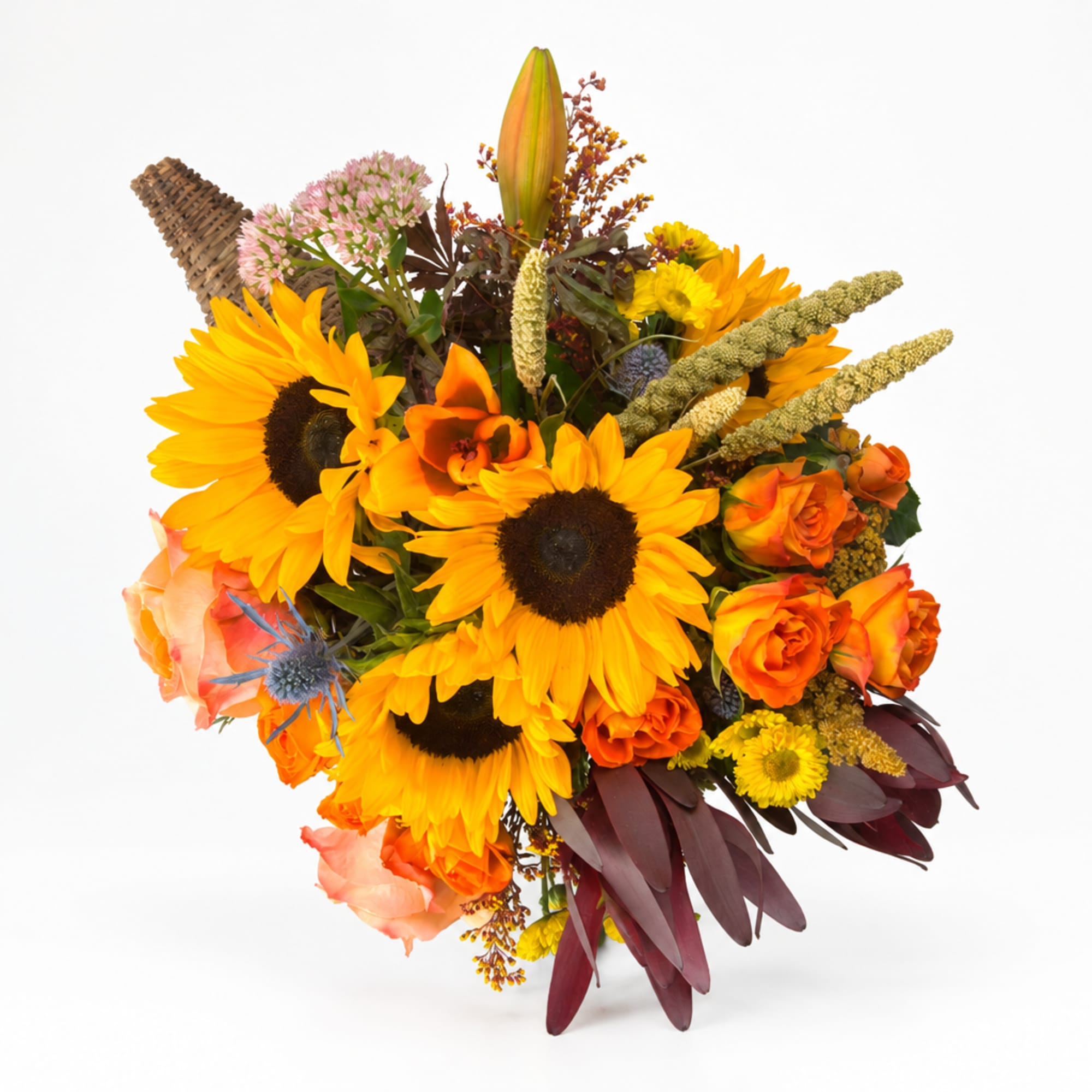 Bouquet of sunflowers, orange roses, and mixed fall flowers