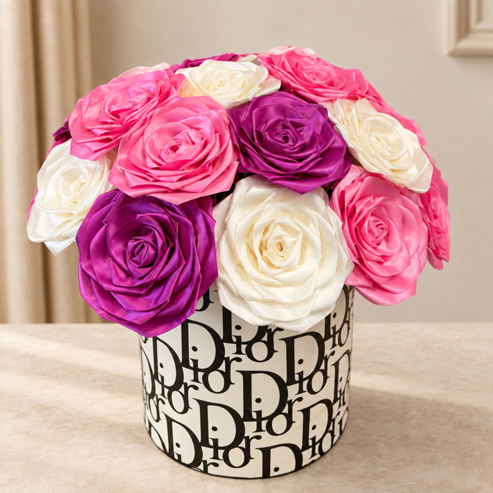 Pink, purple, and white roses arranged in a patterned round box
