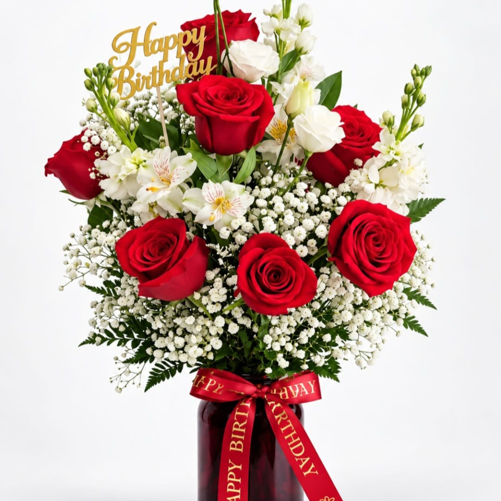 Red and white rose bouquet in a vase with a birthday sign and ribbon