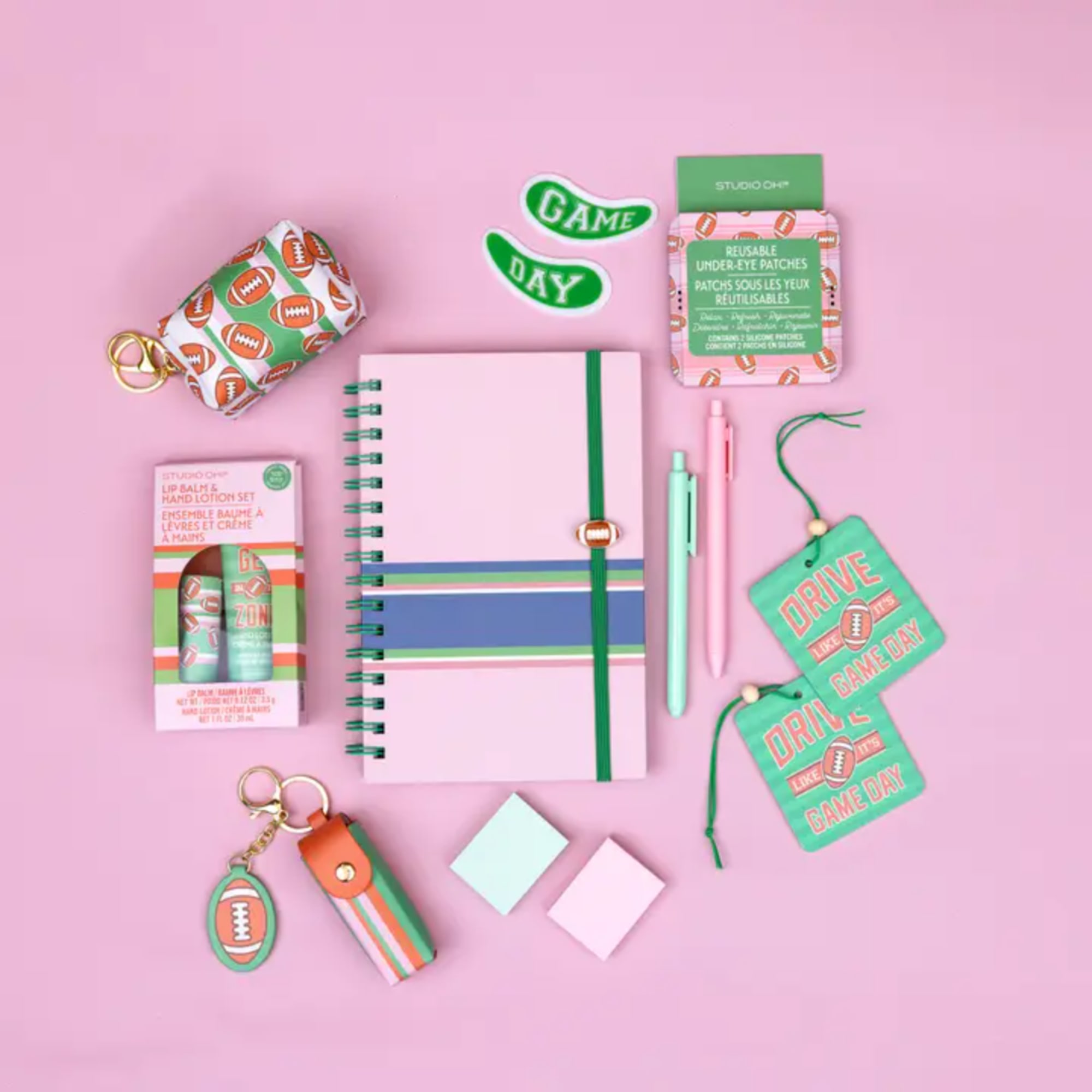 Assorted game-day themed gift items on a pink background