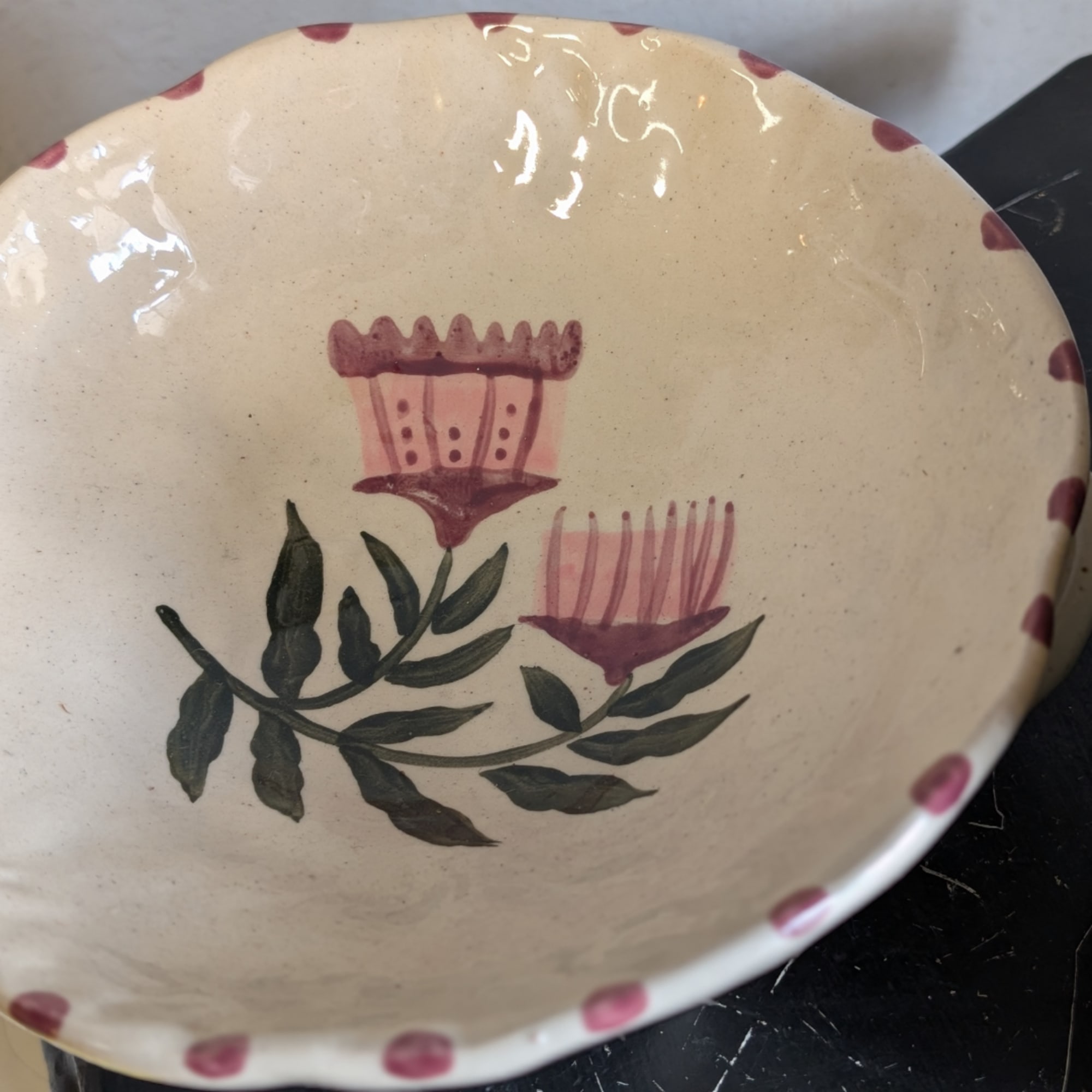 Decorative ceramic bowl with pink floral motifs