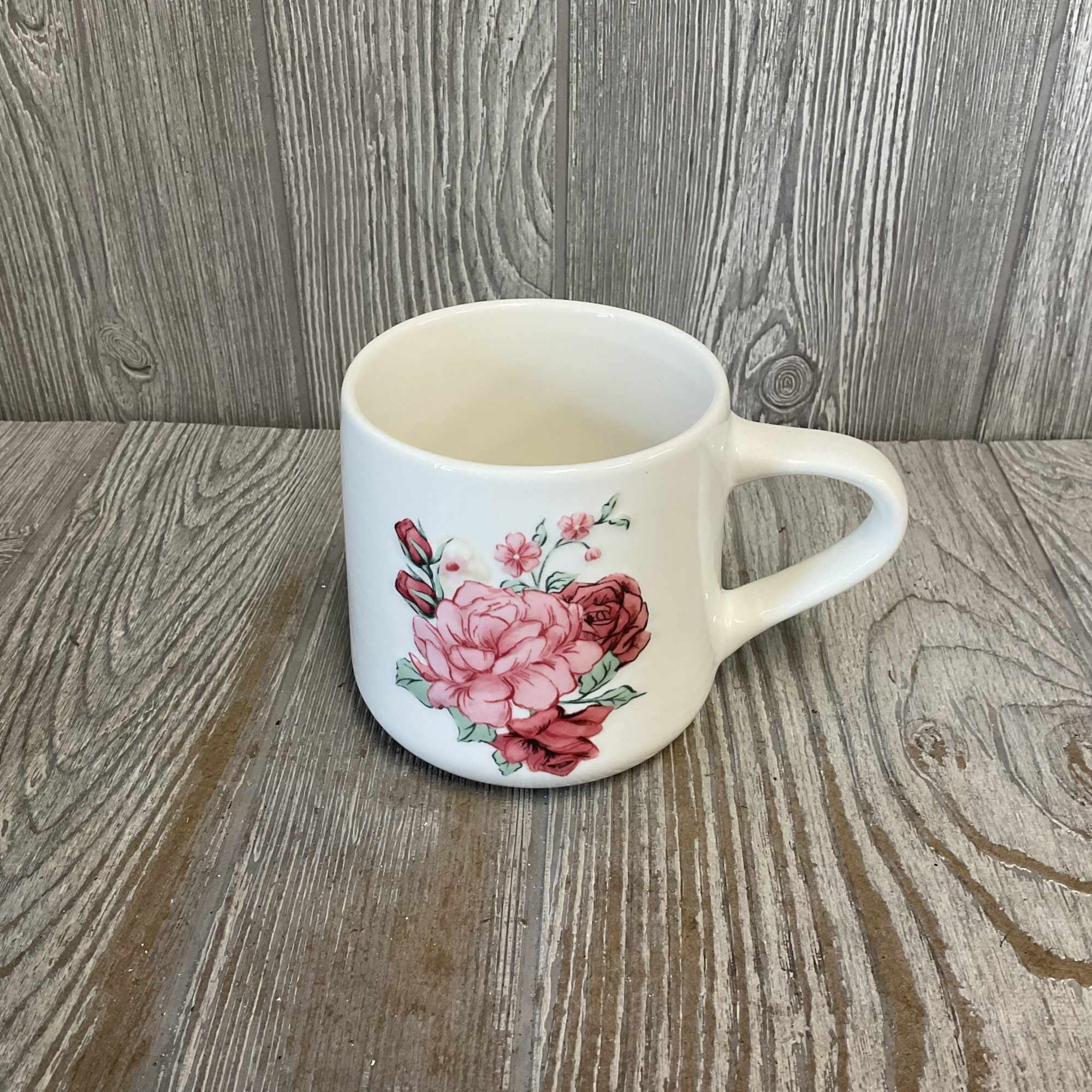 White ceramic mug with pink floral print