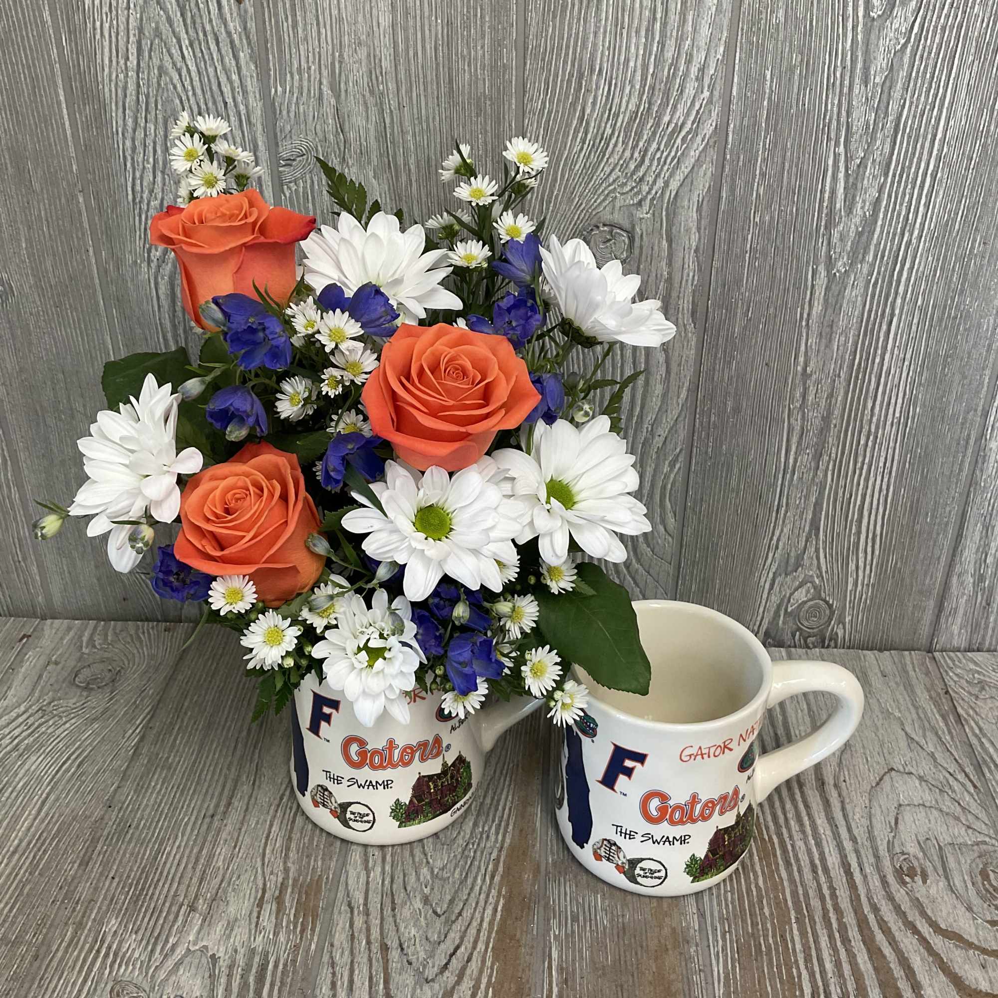 Mixed fresh flowers arranged in a ceramic keepsake Gator mug! Flowers may, photo 2 of 3