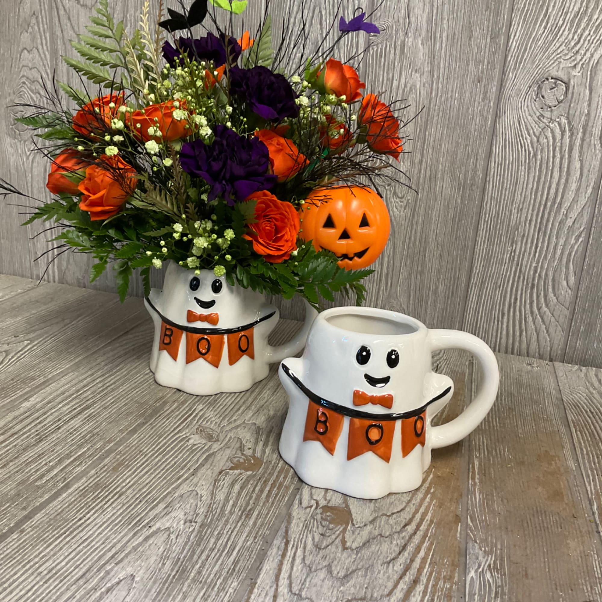 Halloween bouquet in a ghost mug with orange and purple flowers, photo 2 of 3