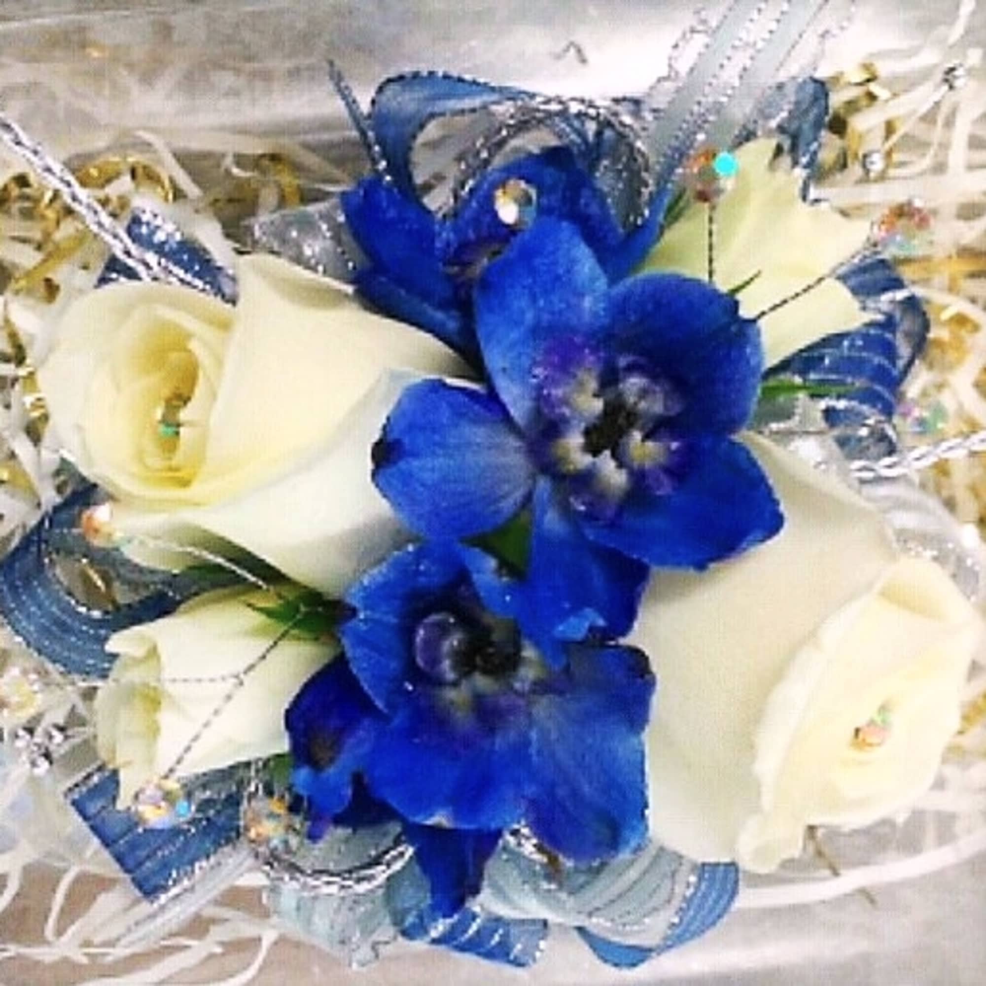 Blue and white bouquet with roses and orchids