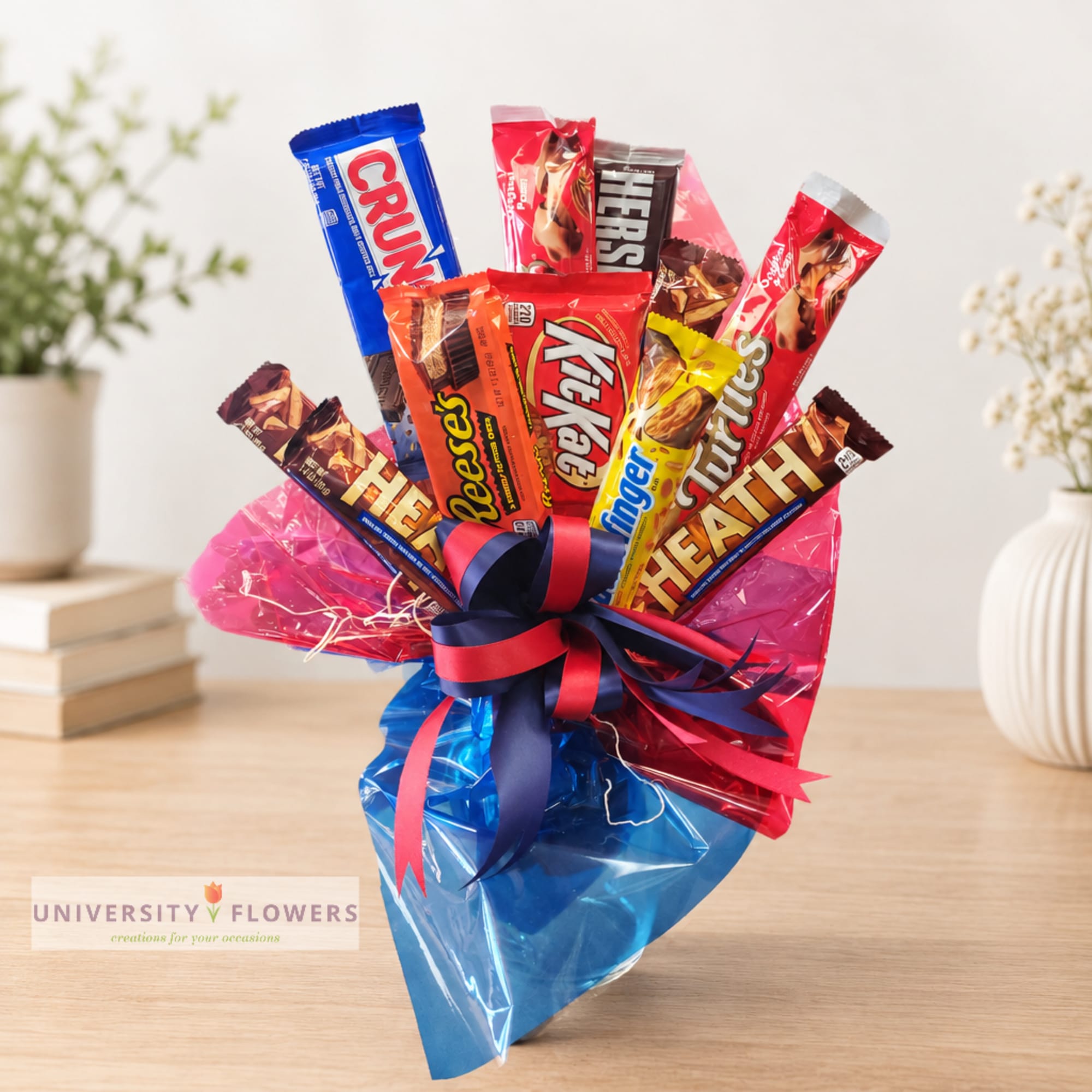 Candy bouquet with assorted chocolate bars wrapped in pink and blue cellophane