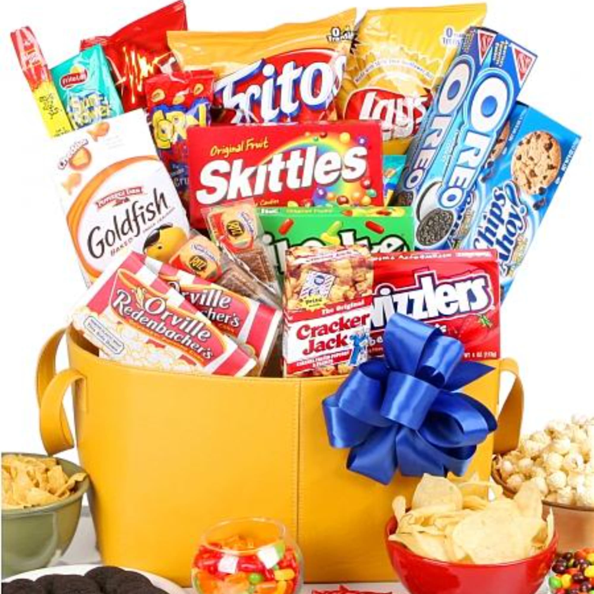 Gift basket filled with assorted snack and candy packages, tied with a blue bow.