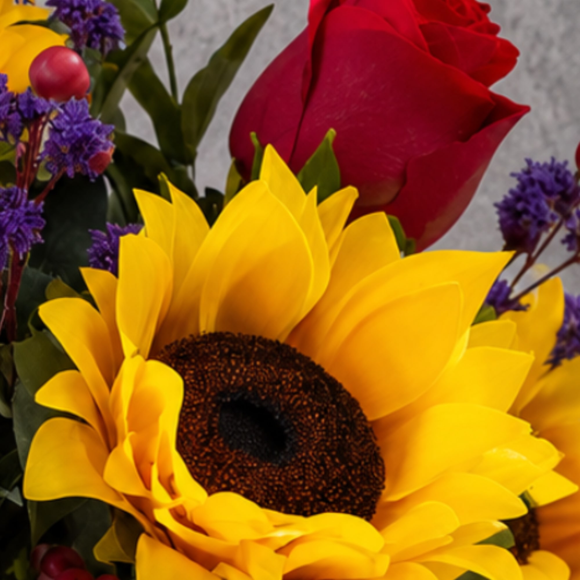Bouquet with a yellow sunflower and red rose