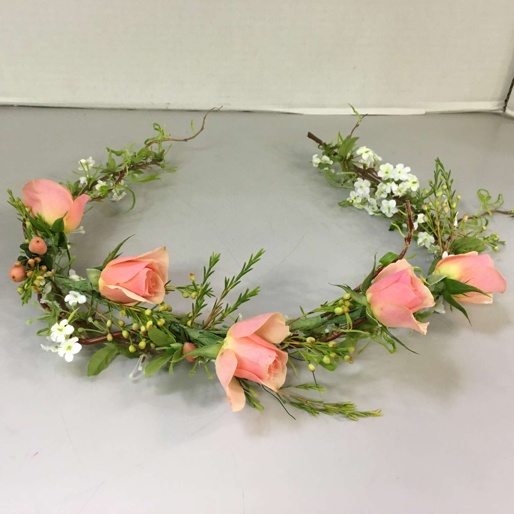Floral crown with peach roses and small white blossoms