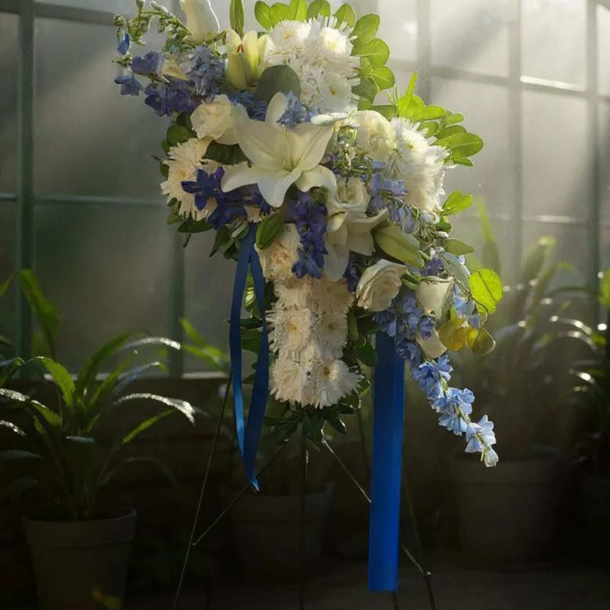 Honor your loved one with our Heavenly Grace Floral Cross&mdash;a stunning arrangement