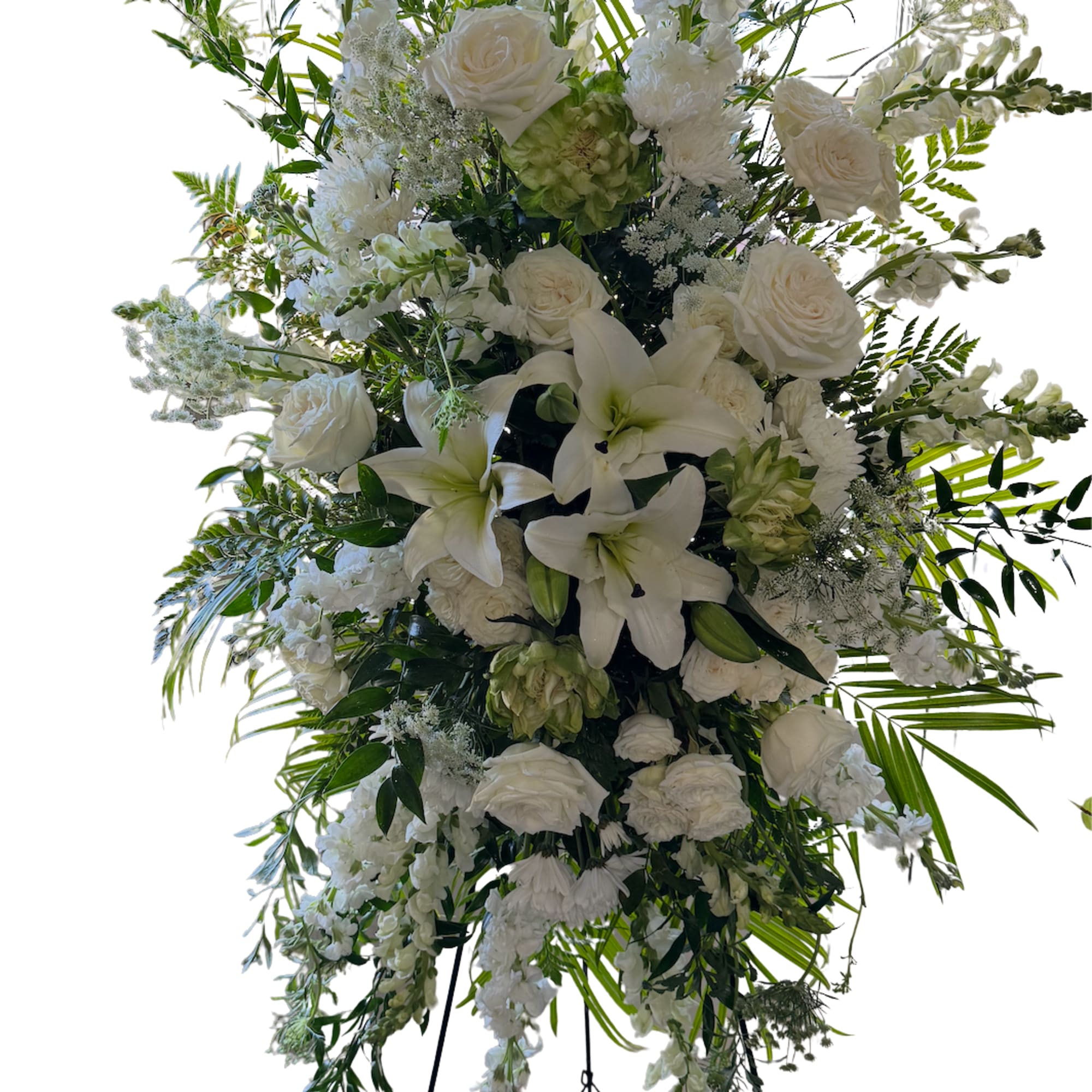 Large white floral standing spray on an easel